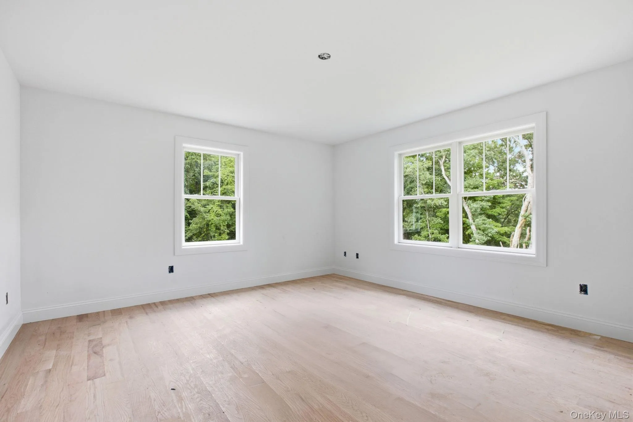 Bedroom three continues the home’s well-appointed finishes with hardwood flooring and a thoughtfully designed space Bedroom three continues the home’s well-appointed finishes with hardwood flooring and a thoughtfully designed space
