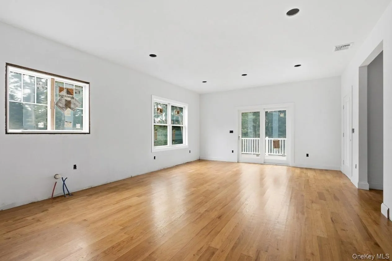 Virtually staged eat-in kitchen showcases the warmth and beauty of the wood flooring, offering a glimpse of the finished space. With construction still underway, there is time to select a different floor stain to reflect your personal style. Virtually staged eat-in kitchen showcases the warmth and beauty of the wood flooring, offering a glimpse of the finished space. With construction still underway, there is time to select a different floor stain to reflect your personal style.