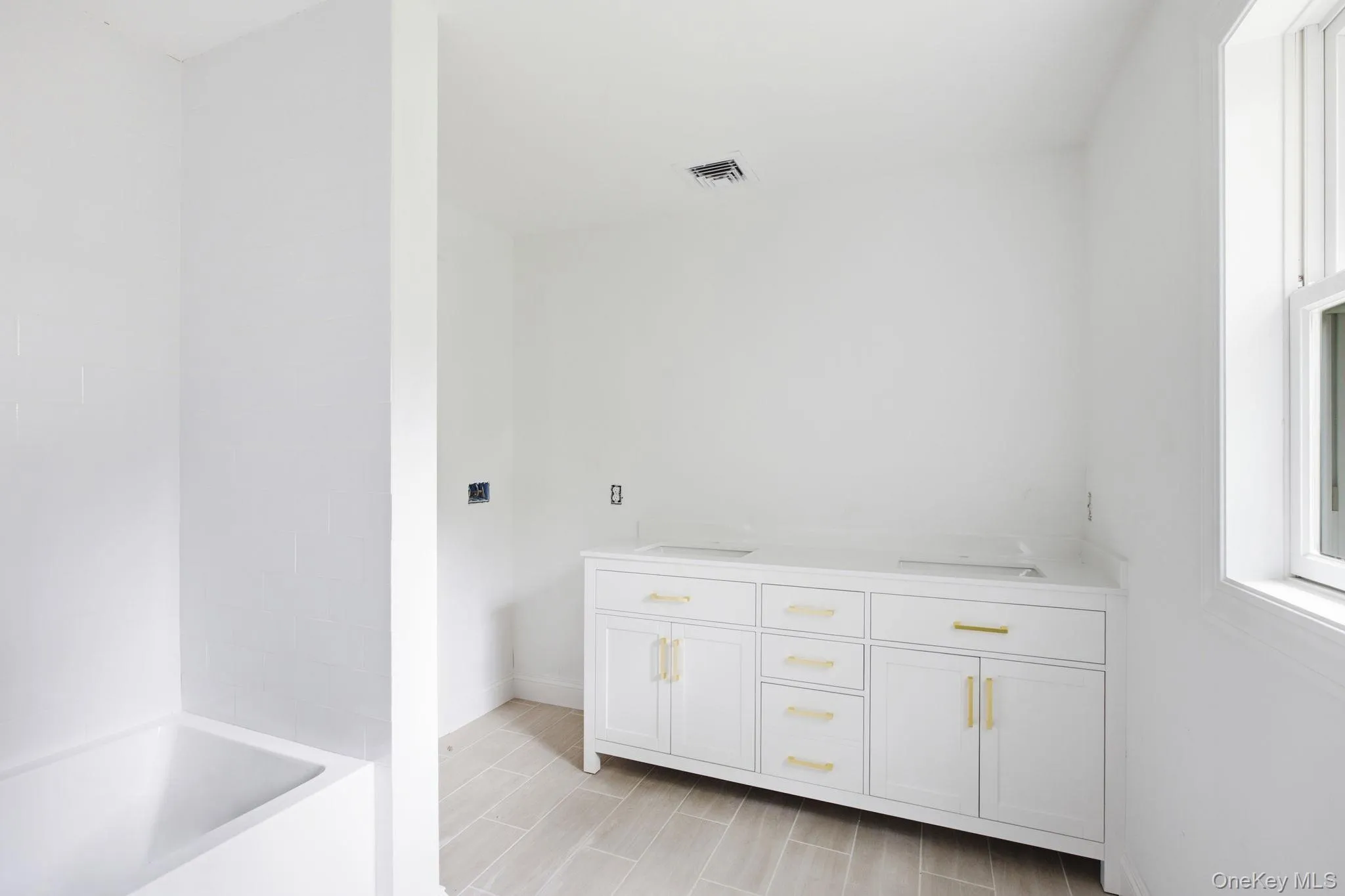 Well-appointed hall bath featuring a dual vanity and tub/shower combination, thoughtfully designed for both style and everyday convenience. Well-appointed hall bath featuring a dual vanity and tub/shower combination, thoughtfully designed for both style and everyday convenience.