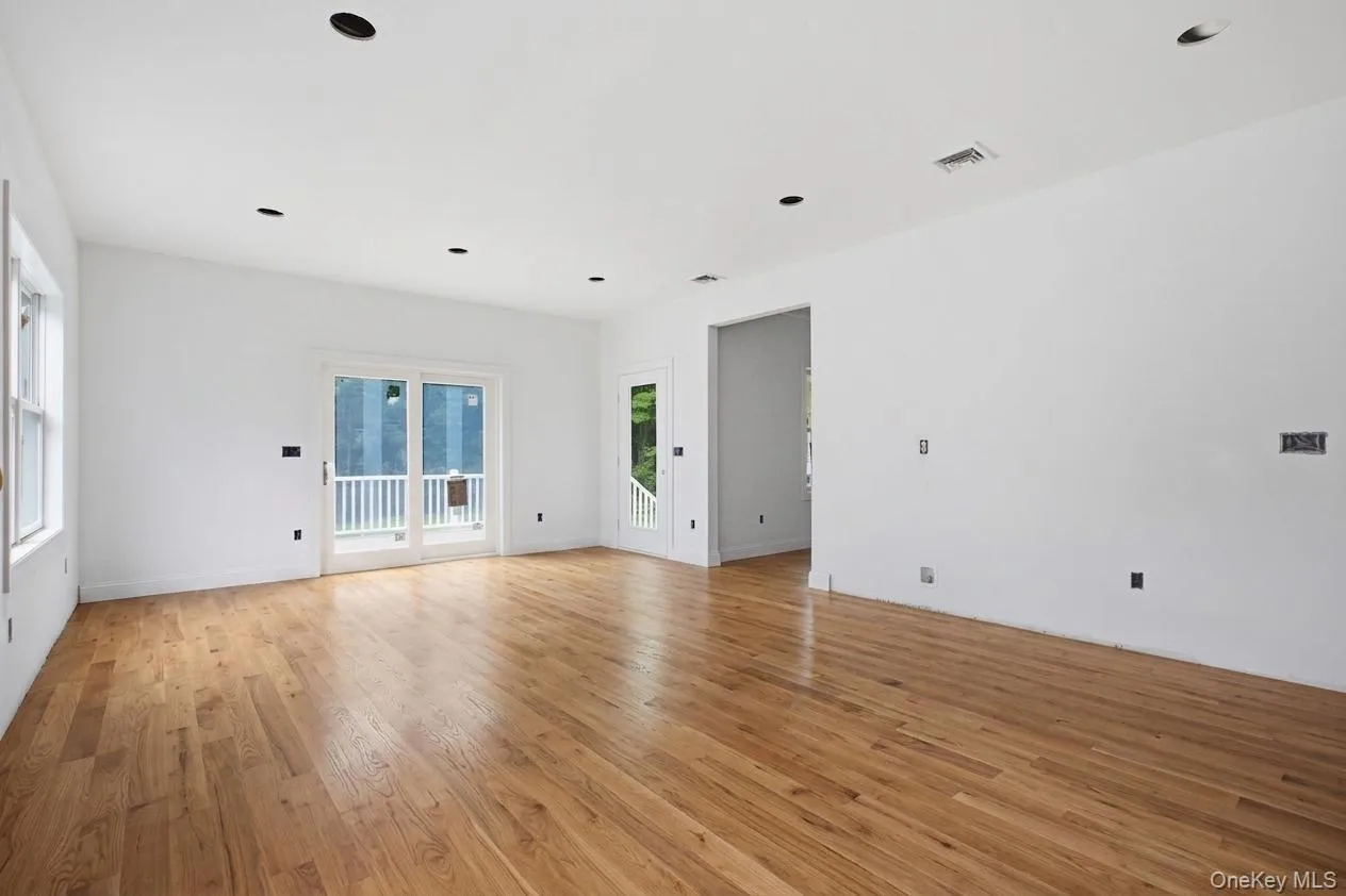 Virtually staged to showcase the beauty of warm-stained hardwood floors, this inviting kitchen offers a glimpse of its finished potential—with time remaining to select a stain color that reflects your personal style. Virtually staged to showcase the beauty of warm-stained hardwood floors, this inviting kitchen offers a glimpse of its finished potential—with time remaining to select a stain color that reflects your personal style.