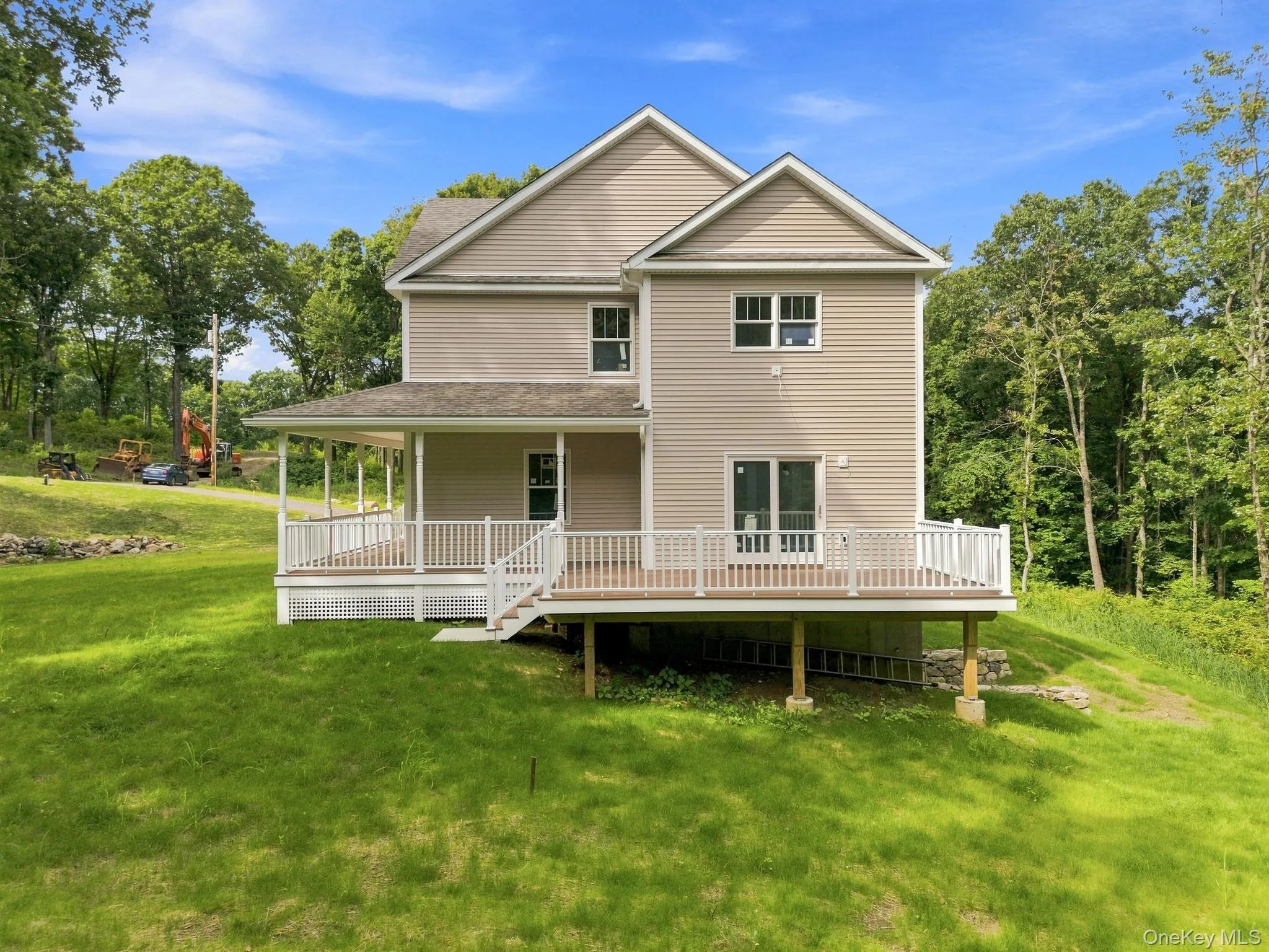 This view beautifully demonstrates the seamless connection from the charming front porch to the expansive Trex deck and backyard, creating a natural flow for outdoor living and entertaining. This view beautifully demonstrates the seamless connection from the charming front porch to the expansive Trex deck and backyard, creating a natural flow for outdoor living and entertaining.