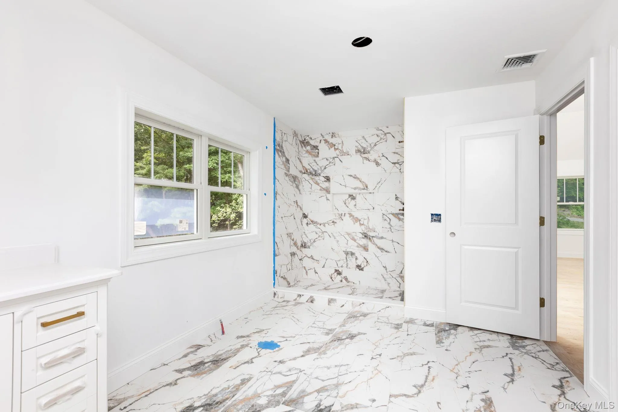 A private water closet adds an additional layer of comfort and convenience, completing this beautifully appointed primary bath. A private water closet adds an additional layer of comfort and convenience, completing this beautifully appointed primary bath.