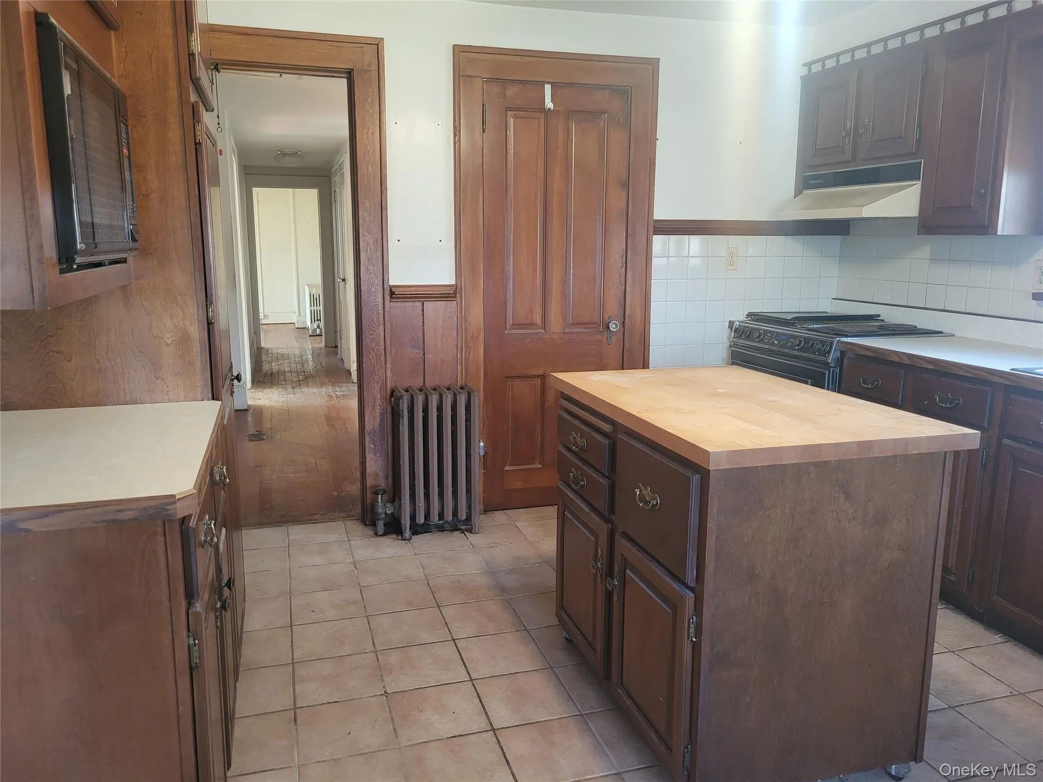 Kitchen with island, plenty of cabinets with microwave, and pantry Kitchen with island, plenty of cabinets with microwave, and pantry