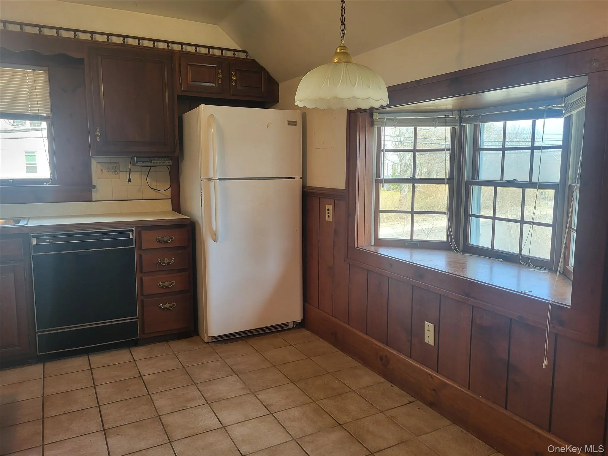 Eat-in kitchen with newer refrigerator Eat-in kitchen with newer refrigerator