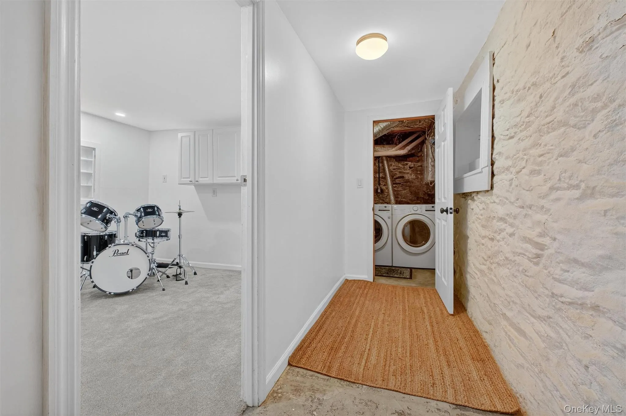 Washroom featuring separate washer and dryer and carpet flooring Washroom featuring separate washer and dryer and carpet flooring