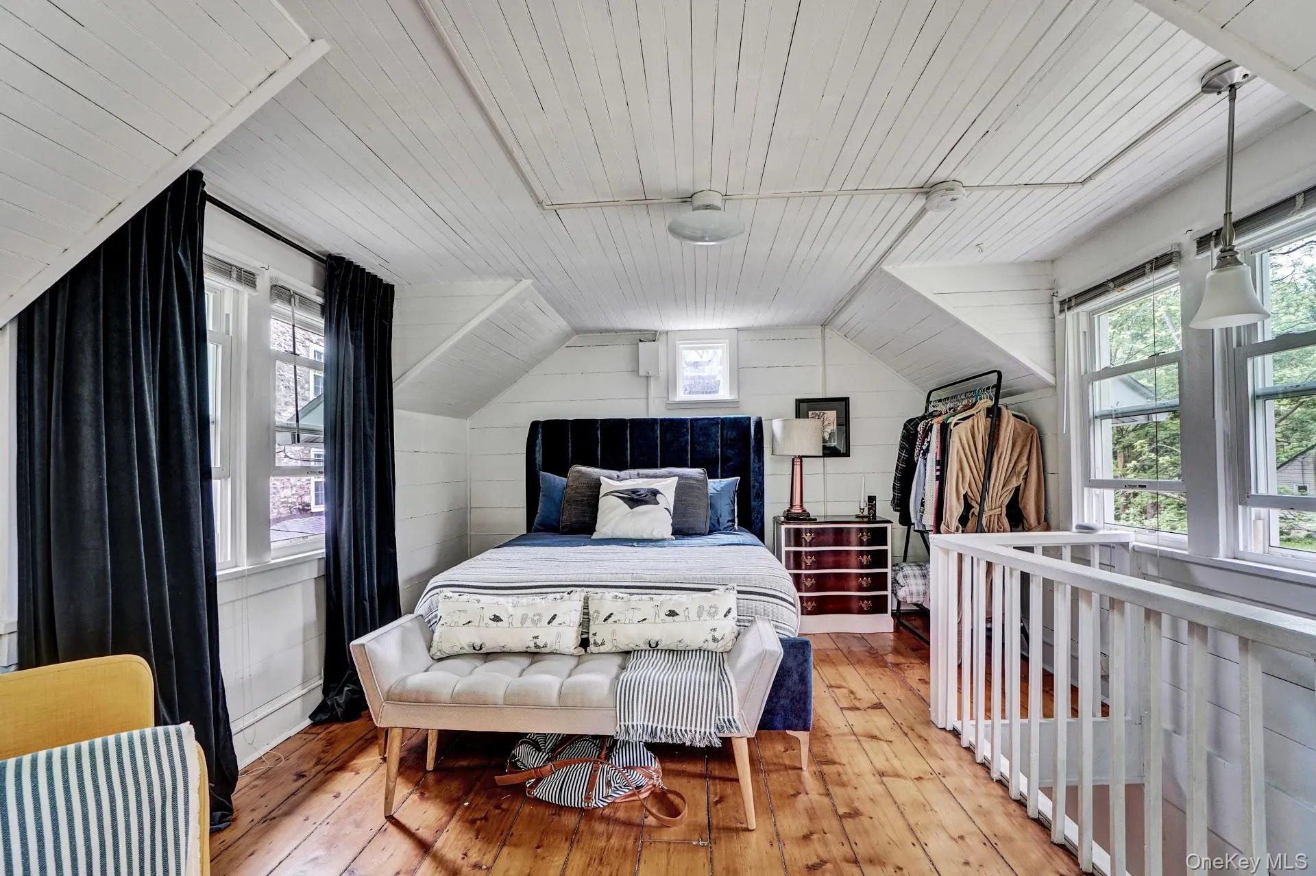 Bedroom featuring vaulted ceiling, light wood-type flooring, and wooden ceiling Bedroom featuring vaulted ceiling, light wood-type flooring, and wooden ceiling