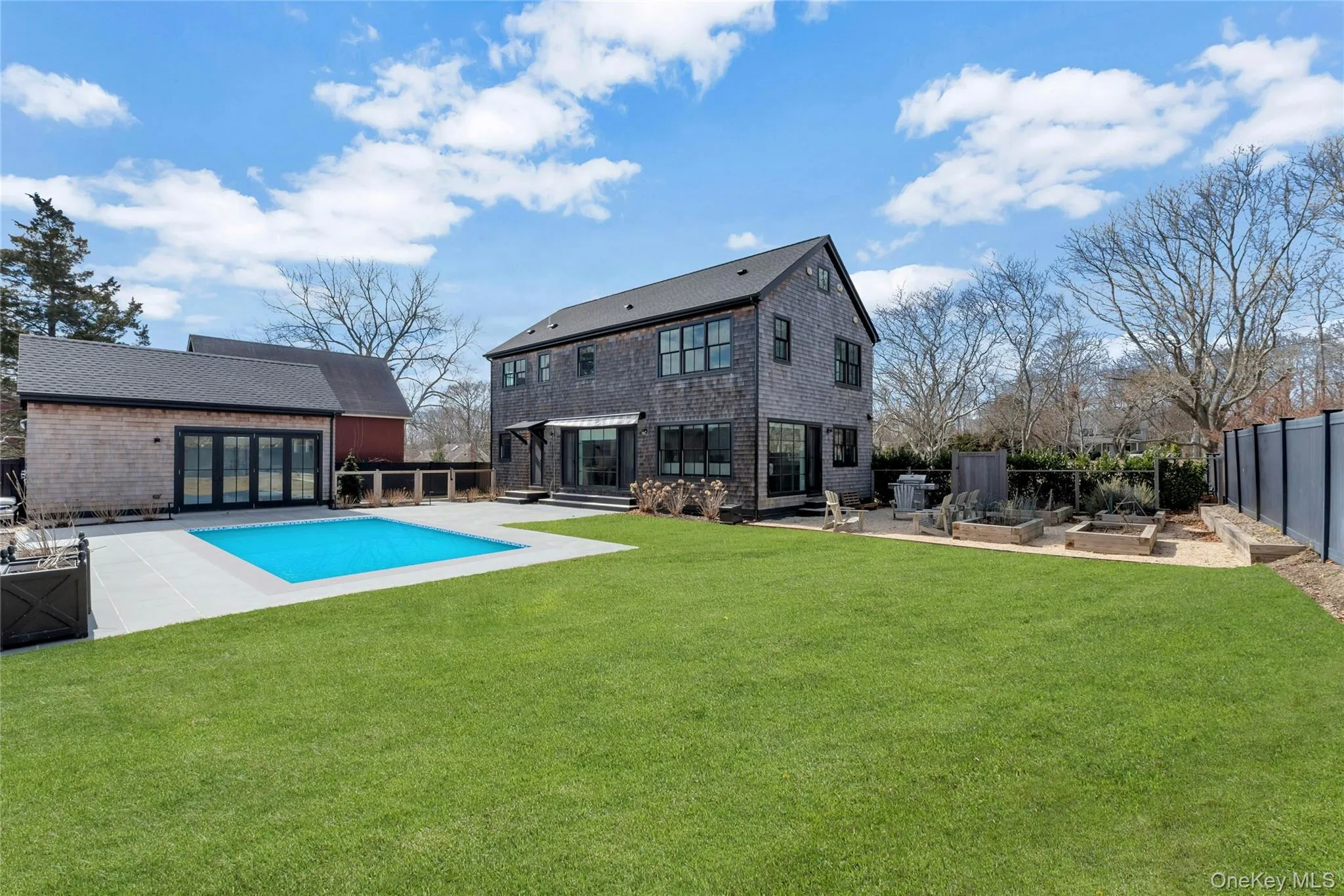 Private outdoor oasis with an in-ground heated pool, bluestone patio, and detached pool house in the heart of New Suffolk. Private outdoor oasis with an in-ground heated pool, bluestone patio, and detached pool house in the heart of New Suffolk.