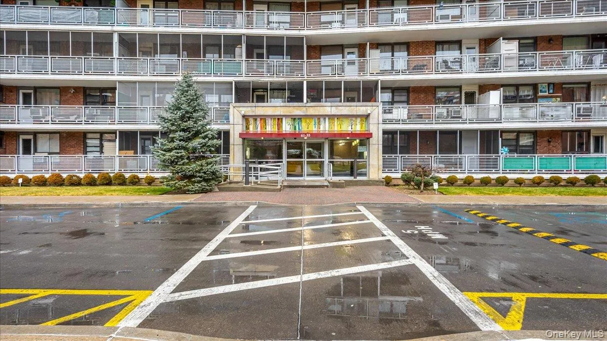 View of apartment building / complex featuring uncovered parking View of apartment building / complex featuring uncovered parking