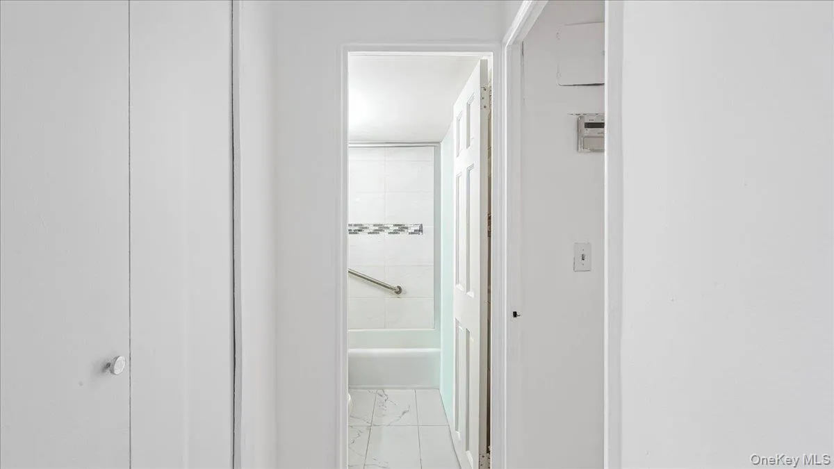 Hallway with light marble finish flooring Hallway with light marble finish flooring