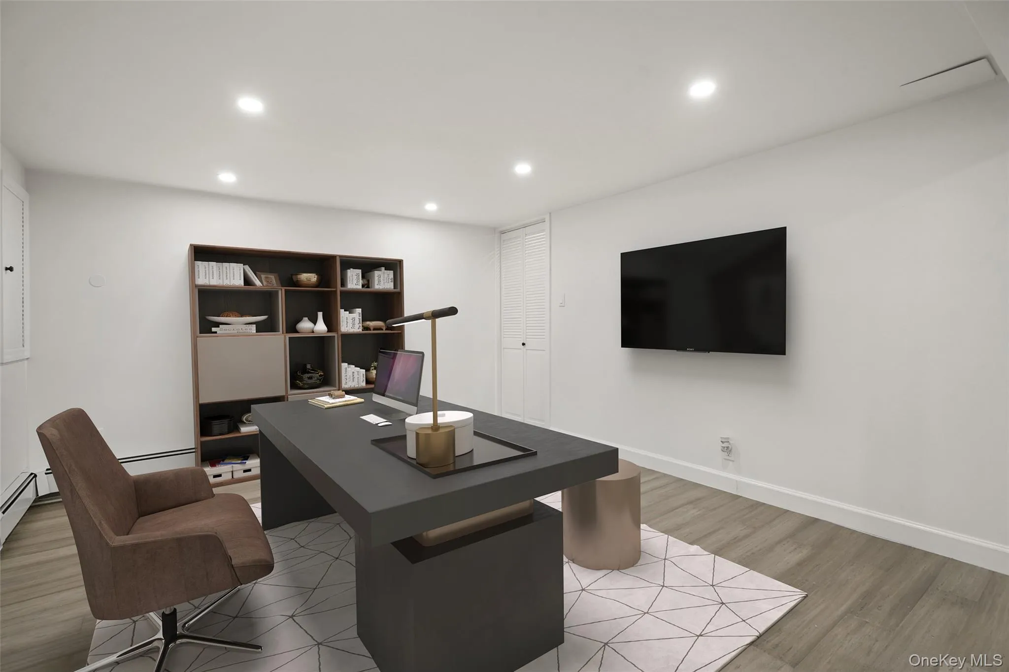 Office space featuring light wood finished floors, recessed lighting, and baseboard heating. *Virtually Staged* Office space featuring light wood finished floors, recessed lighting, and baseboard heating. *Virtually Staged*