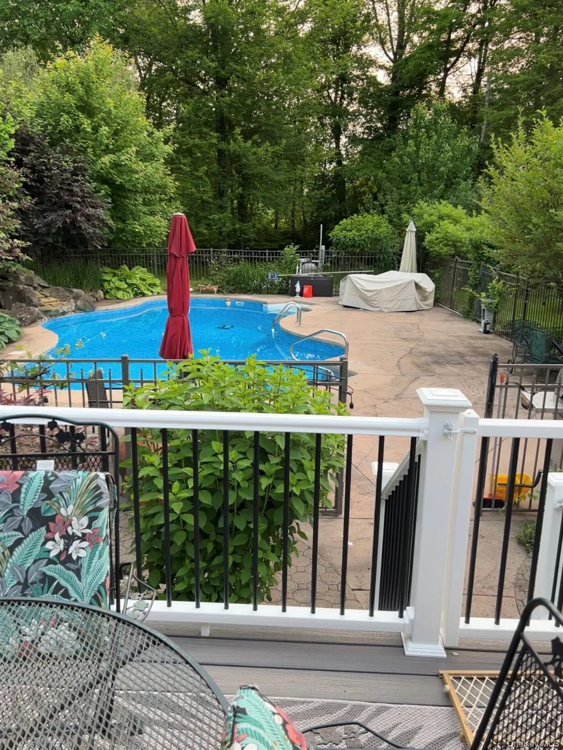 Pool pictured during the warmer season to showcase backyard oasis Pool pictured during the warmer season to showcase backyard oasis