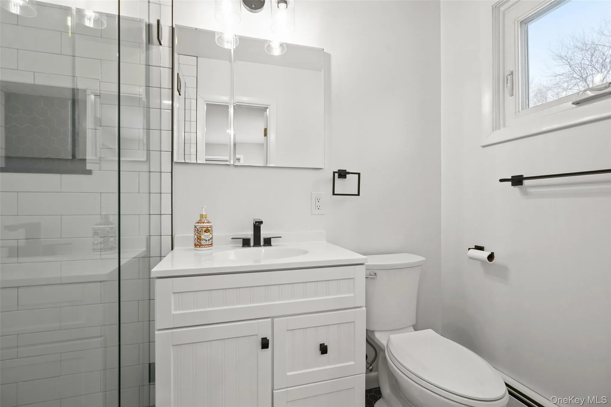 Full bath with vanity and a shower stall Full bath with vanity and a shower stall