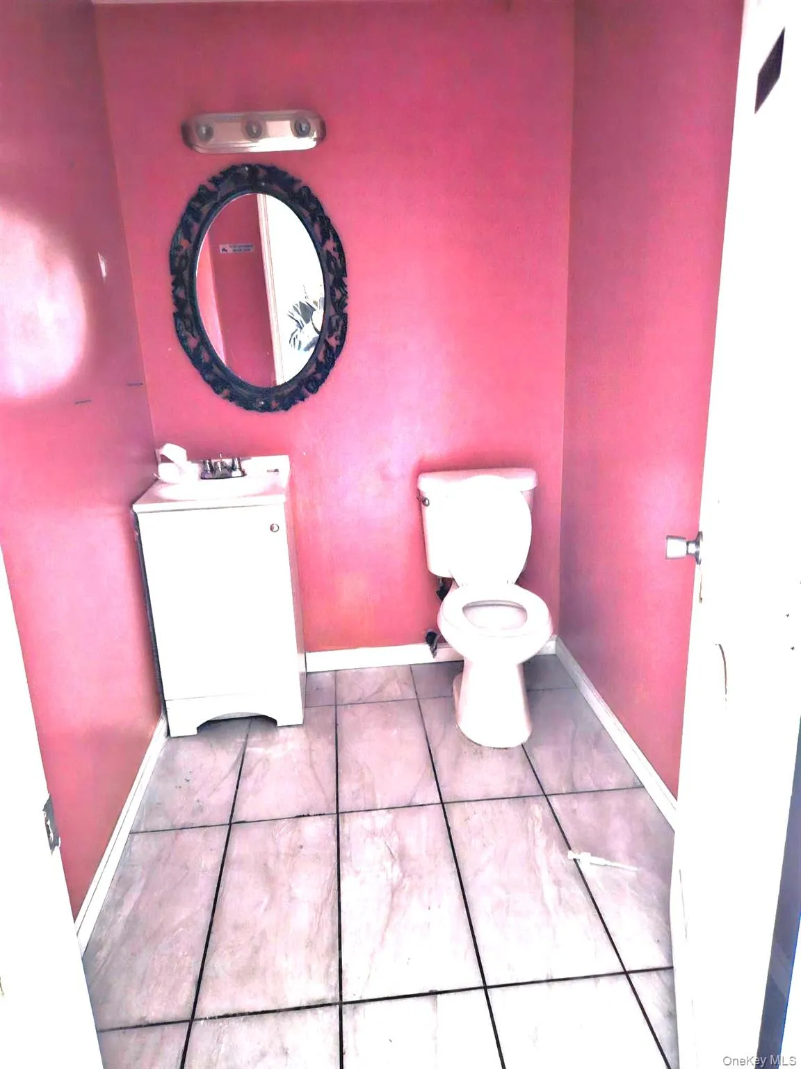 Bathroom with toilet and vanity Bathroom with toilet and vanity