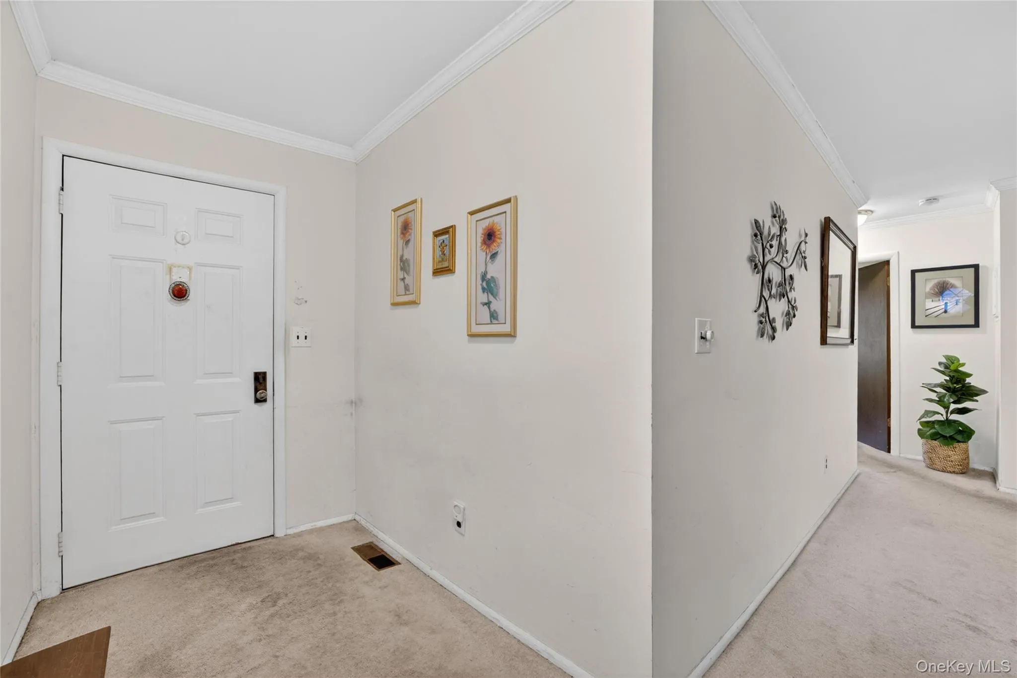Entryway with plenty of space for a bench or credenza/cabinet. Entryway with plenty of space for a bench or credenza/cabinet.