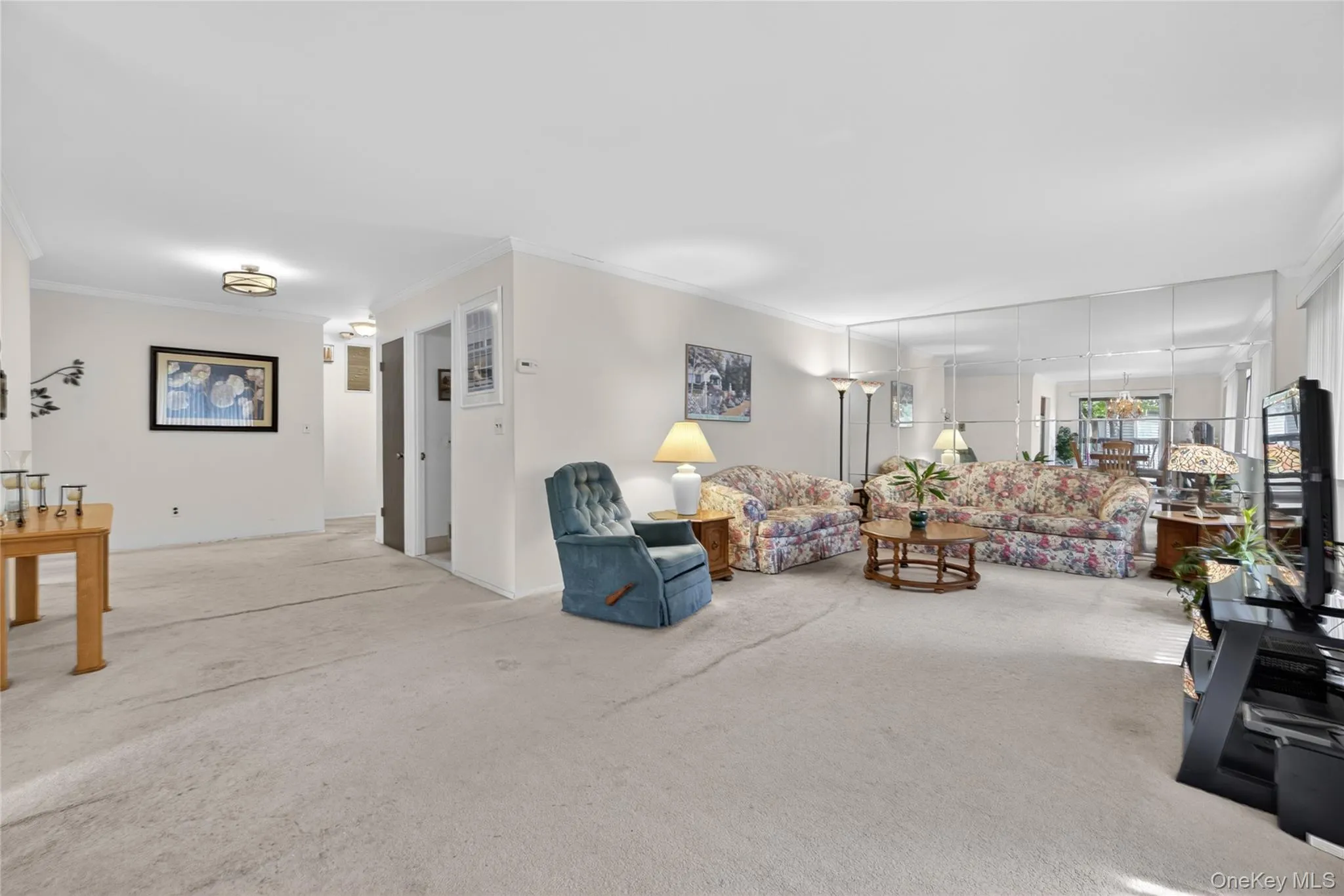View from the dining room shows the open floor plan of the living space. View from the dining room shows the open floor plan of the living space.