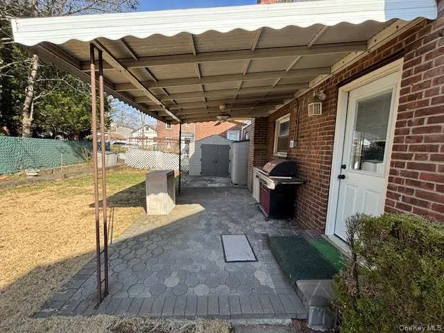 Covered partio and grill with direct kitchen access. Covered partio and grill with direct kitchen access.