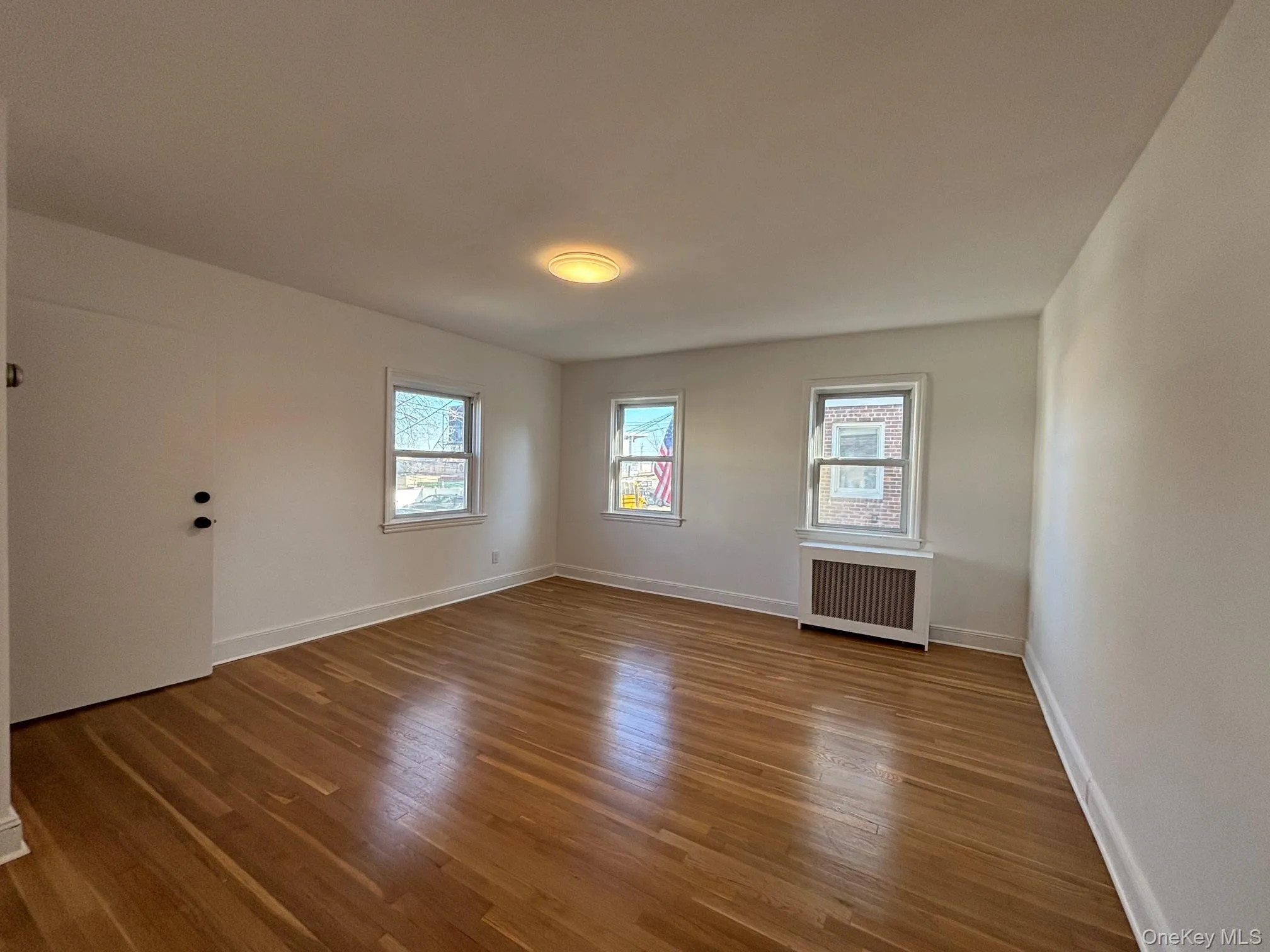 Living room with refinished floor. Living room with refinished floor.
