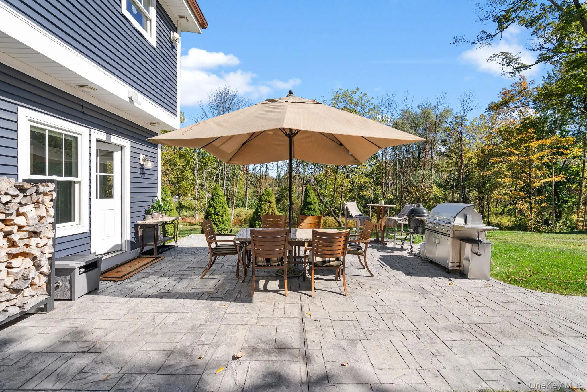 View of patio / terrace with outdoor dining space and grilling area View of patio / terrace with outdoor dining space and grilling area