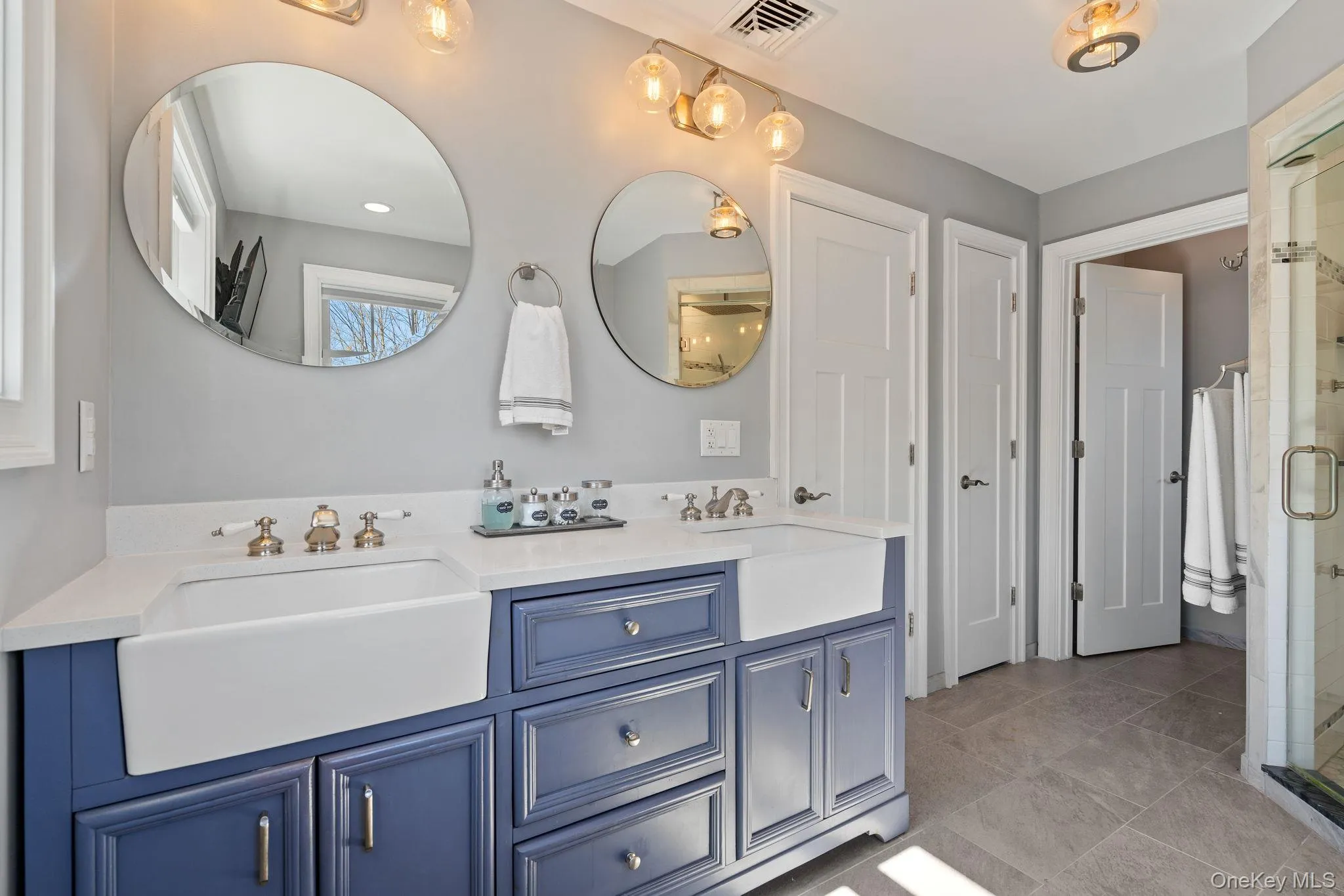 Bathroom with a stall shower and double vanity Bathroom with a stall shower and double vanity