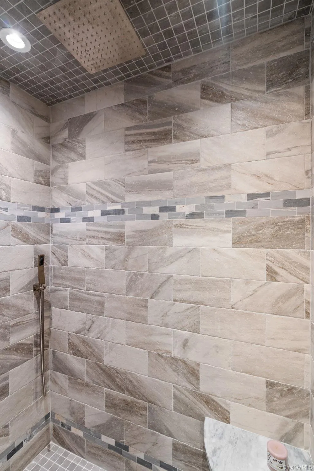 Full bath featuring tiled shower Full bath featuring tiled shower