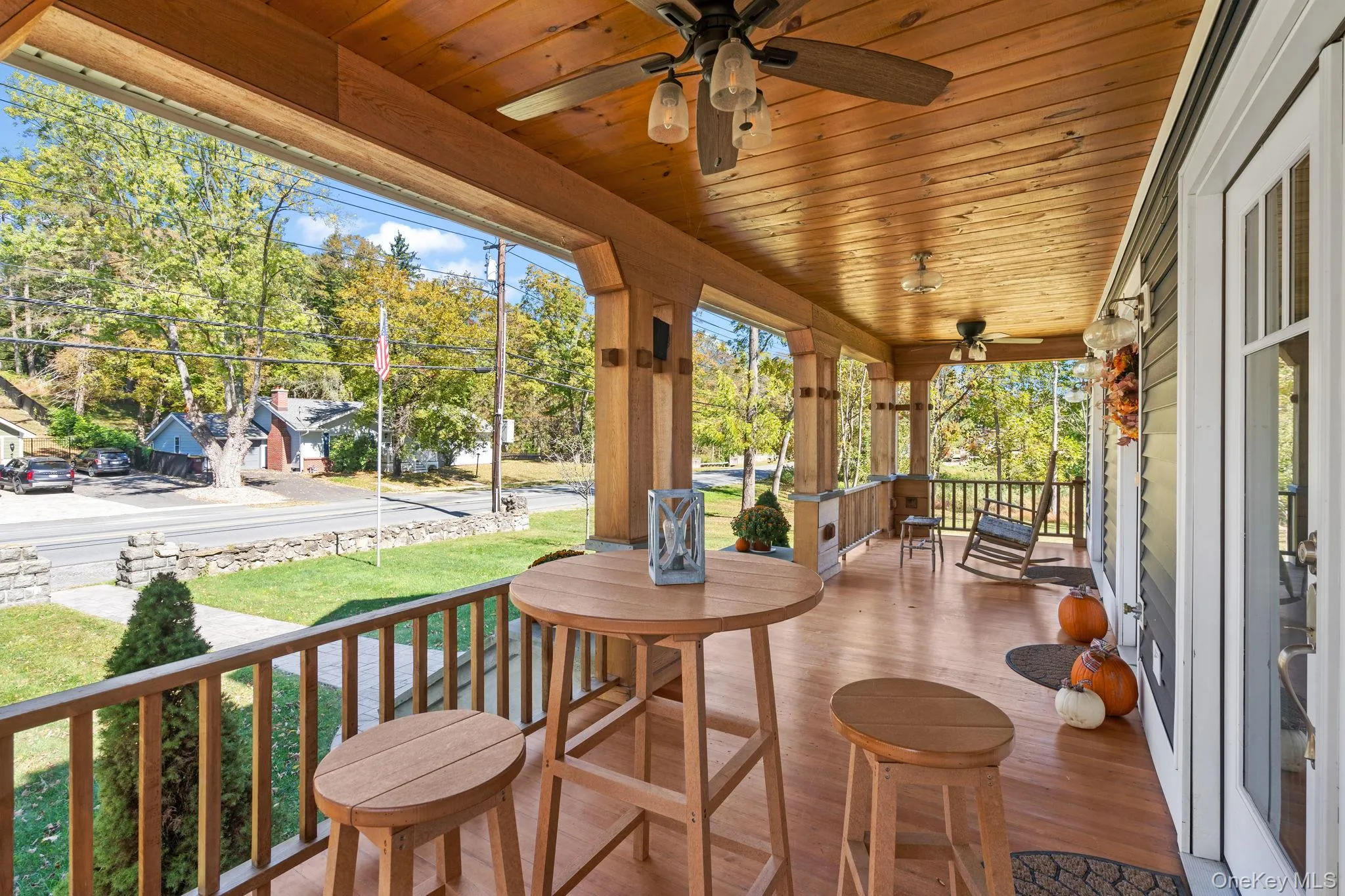 View of patio featuring ceiling fan and view of scattered trees View of patio featuring ceiling fan and view of scattered trees