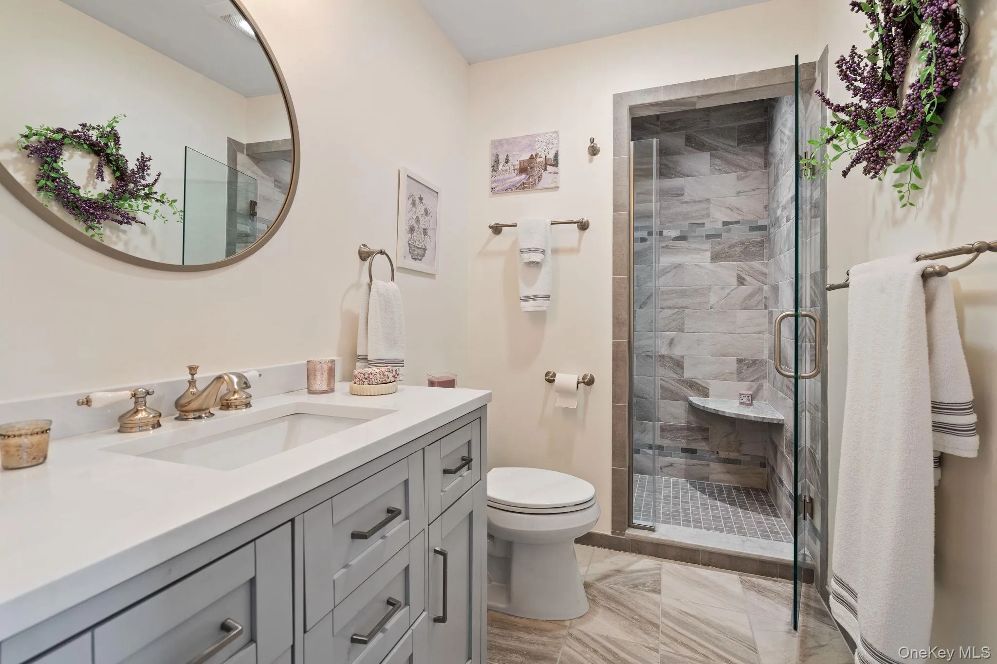 Full bath featuring vanity and a stall shower Full bath featuring vanity and a stall shower