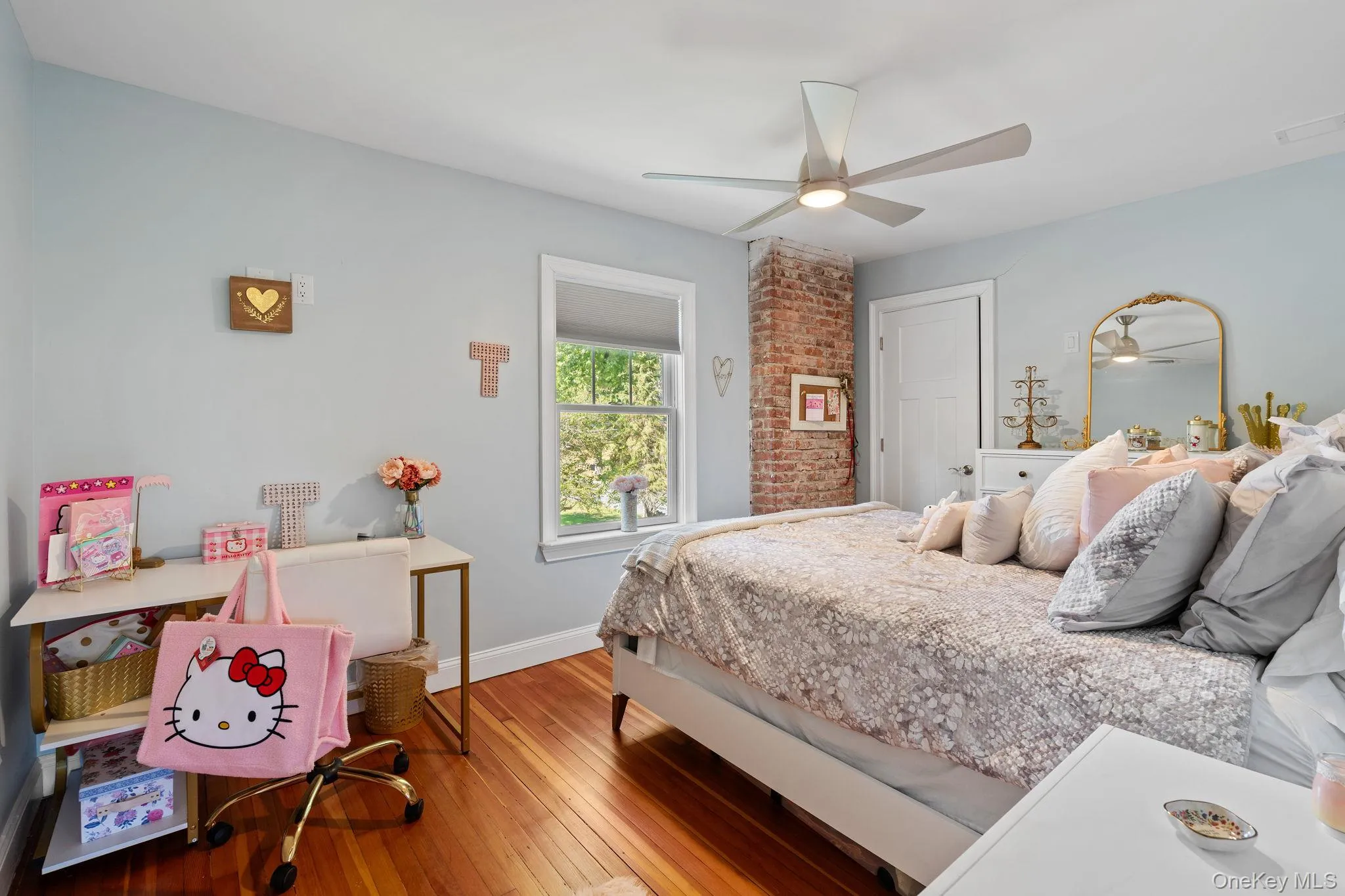Bedroom with hardwood / wood-style flooring and a ceiling fan Bedroom with hardwood / wood-style flooring and a ceiling fan