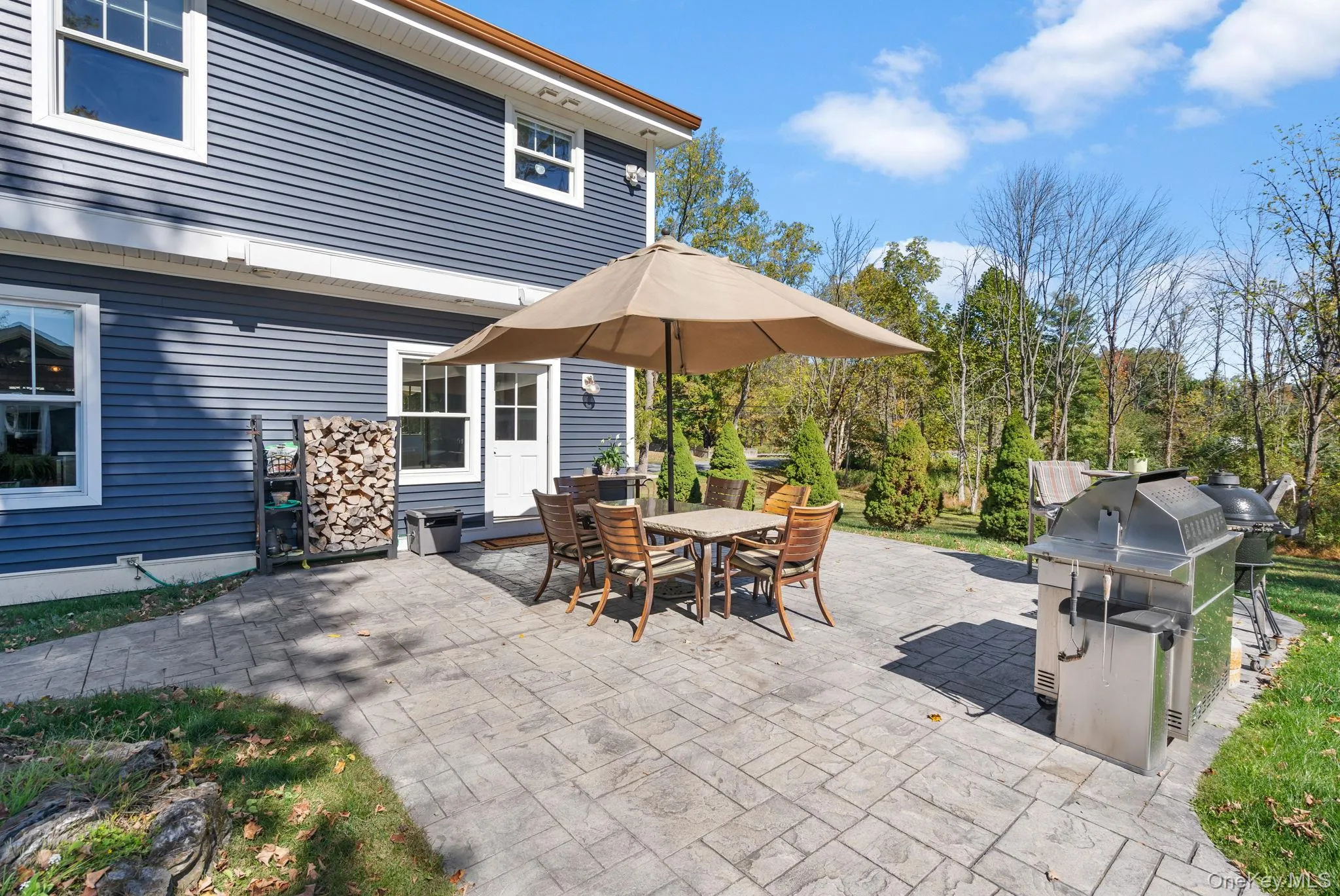 View of patio / terrace featuring outdoor dining area and area for grilling View of patio / terrace featuring outdoor dining area and area for grilling