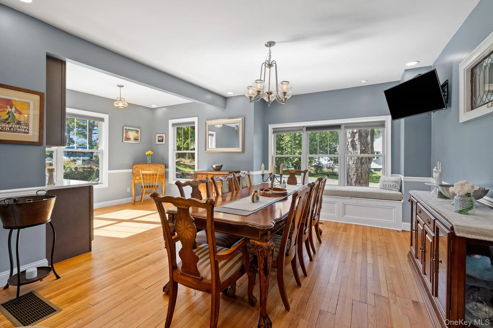 Dining room featuring a chandelier, light wood-style floors, and recessed lighting Dining room featuring a chandelier, light wood-style floors, and recessed lighting
