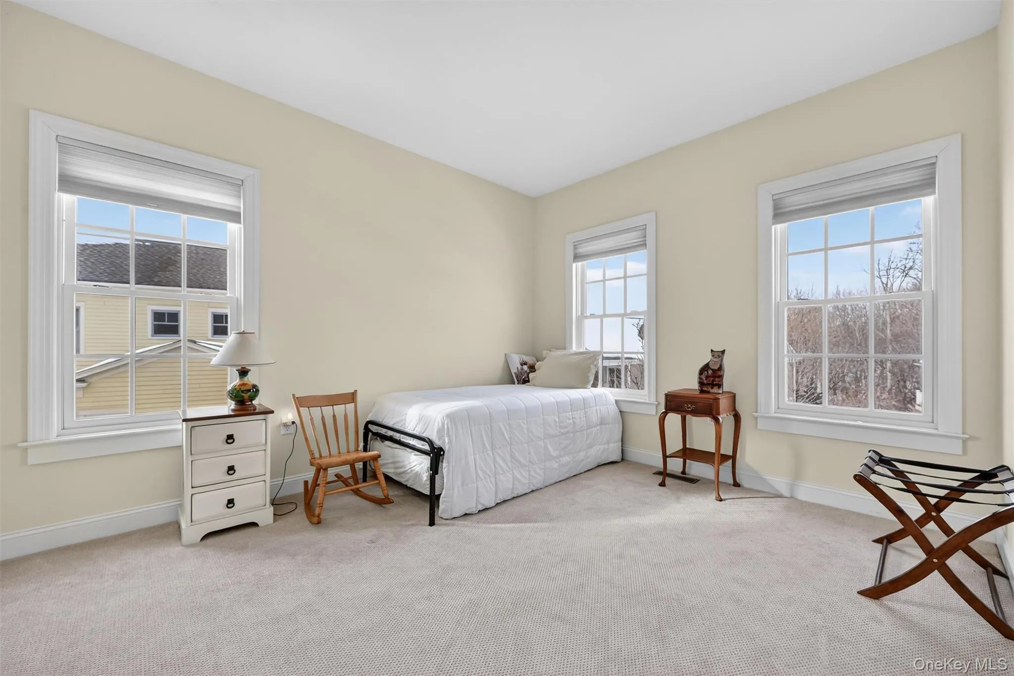 Additional second floor bedroom with peaceful neighborhood views. Additional second floor bedroom with peaceful neighborhood views.