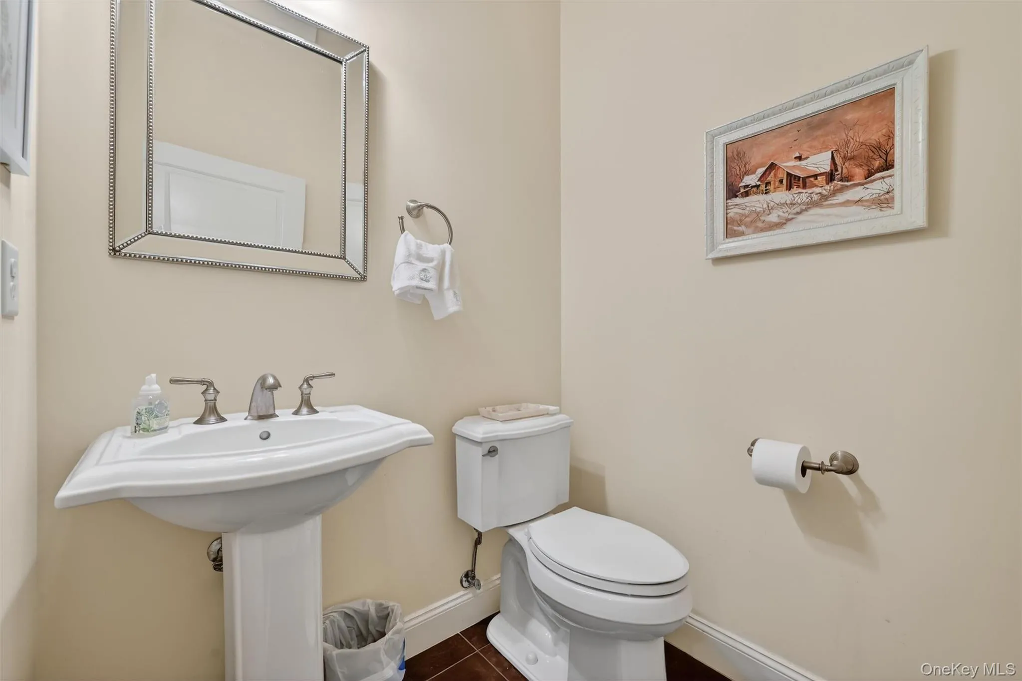 Convenient first-floor powder room for guests. Convenient first-floor powder room for guests.
