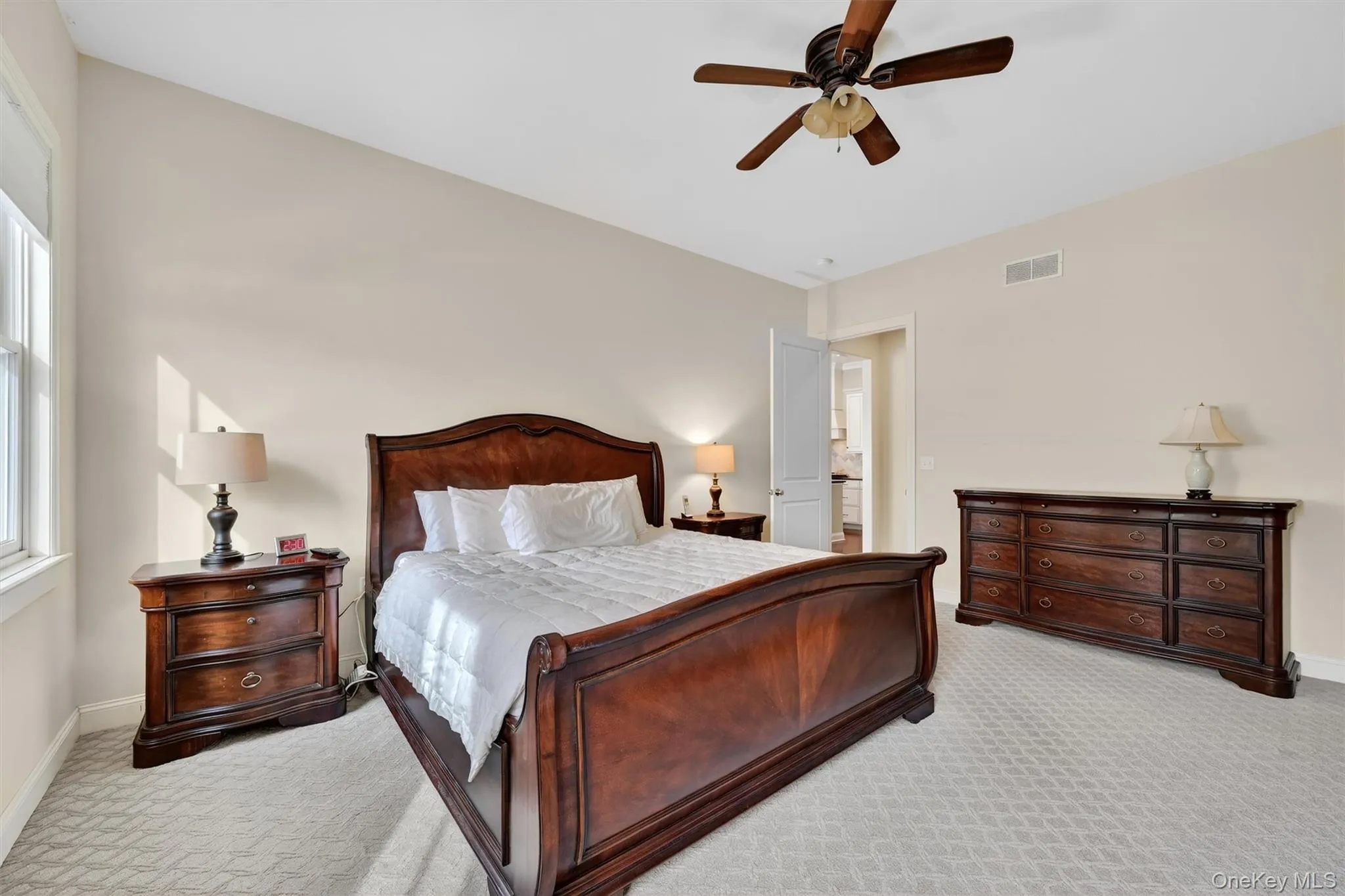 Main-level primary suite offering generous space, natural light, and easy single-level living. Main-level primary suite offering generous space, natural light, and easy single-level living.