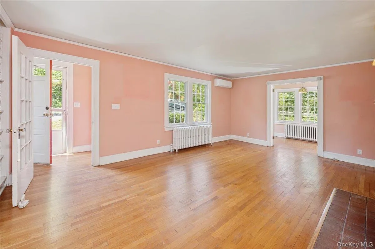 Living room with hardwood floors from front enrance Living room with hardwood floors from front enrance