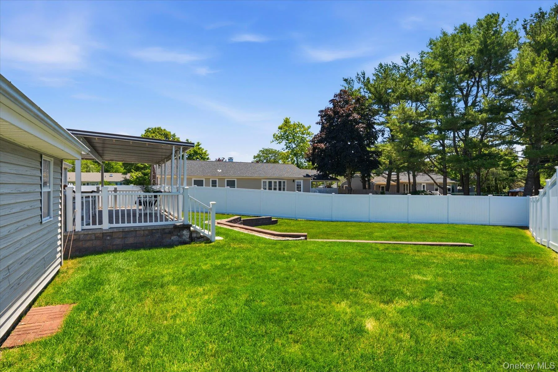 .26 property with nice size yard completely fenced with white vinyl fencing .26 property with nice size yard completely fenced with white vinyl fencing