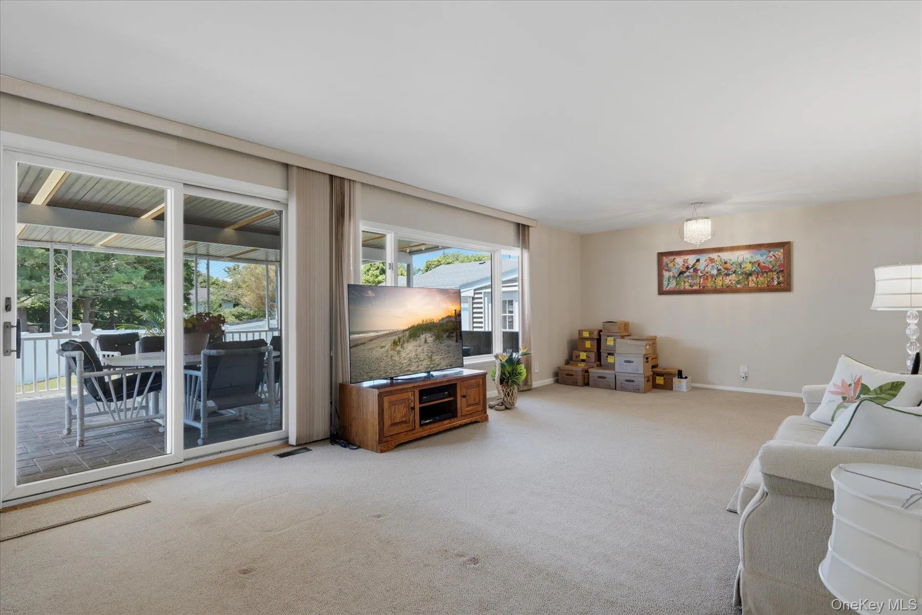 14x26 Living Room with lots of windows overlooking the beautiful cement covered porch. 14x26 Living Room with lots of windows overlooking the beautiful cement covered porch.