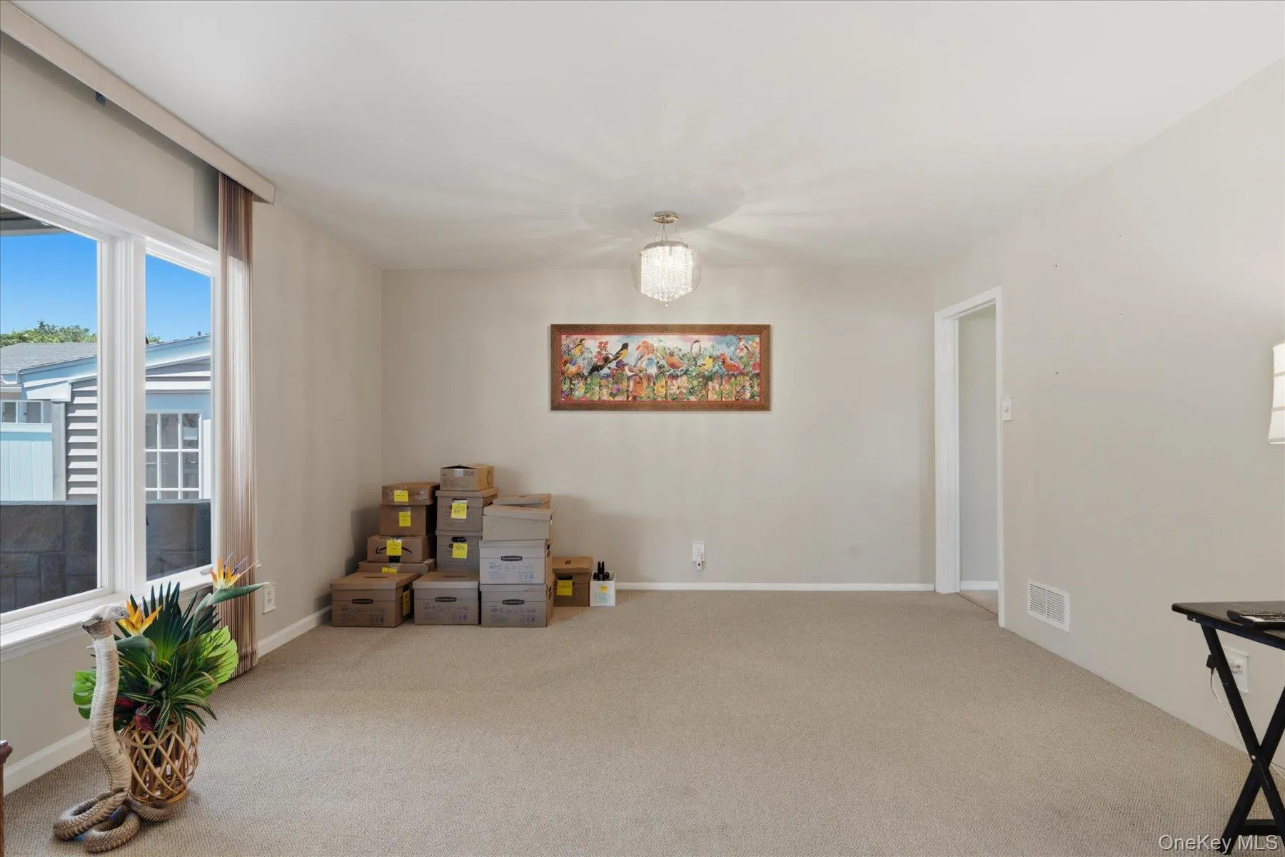 14x26 Living Room with lots of windows overlooking the beautiful cement covered porch. 14x26 Living Room with lots of windows overlooking the beautiful cement covered porch.
