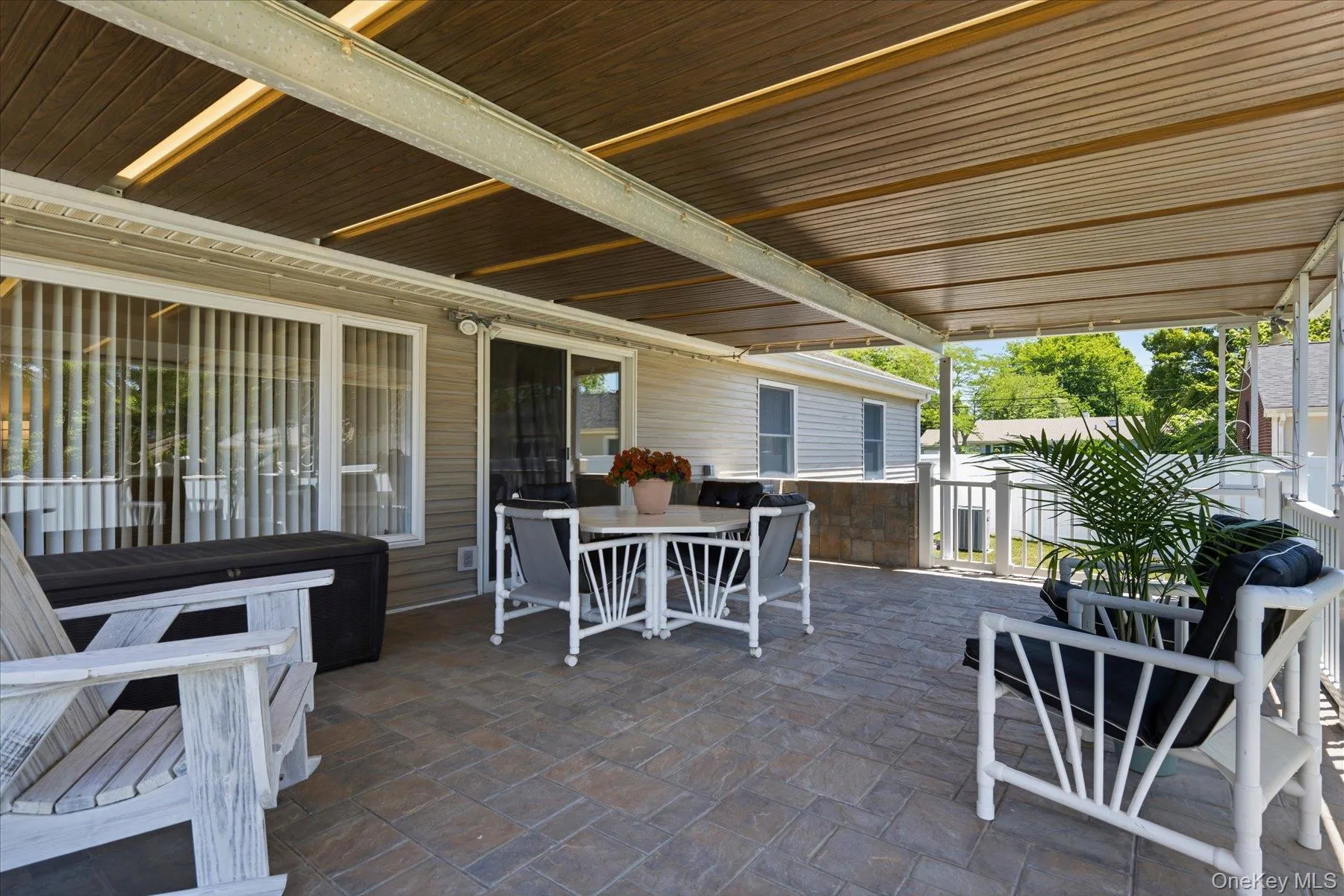 Cozy back cement covered porch with steel I-Beam construction. Cozy back cement covered porch with steel I-Beam construction.