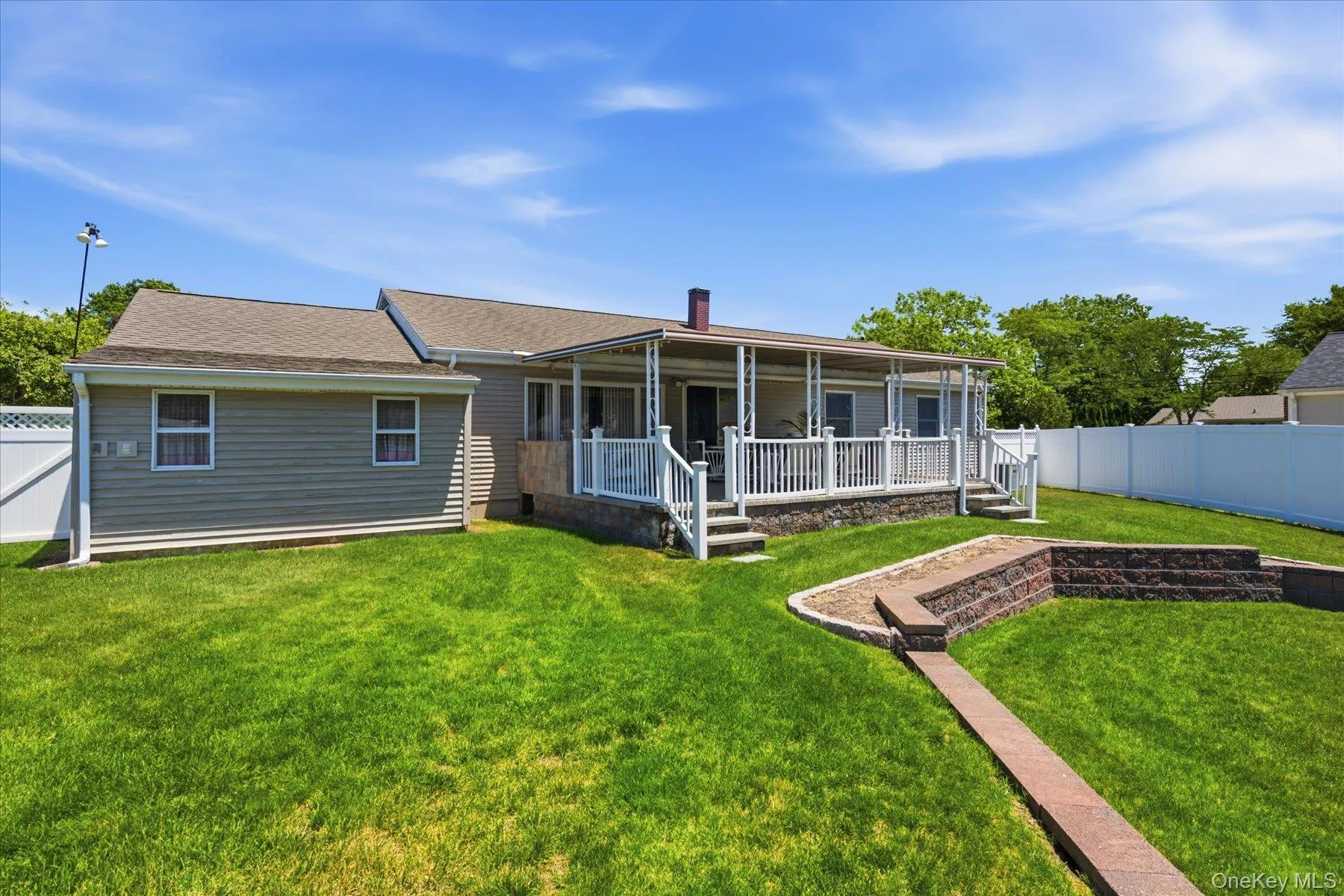 Beautiful two level yard with vinyl fencing Beautiful two level yard with vinyl fencing