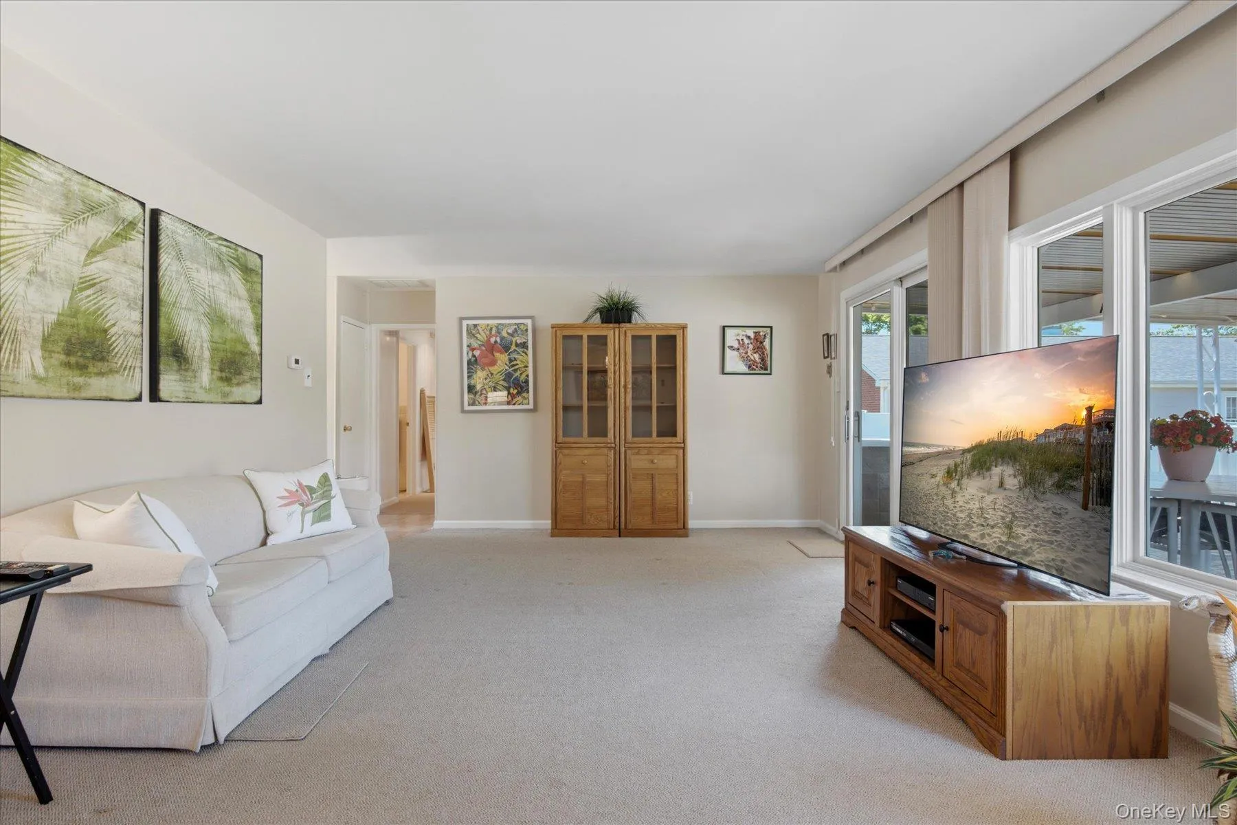 14x26 Living Room with lots of windows overlooking the beautiful cement covered porch. 14x26 Living Room with lots of windows overlooking the beautiful cement covered porch.