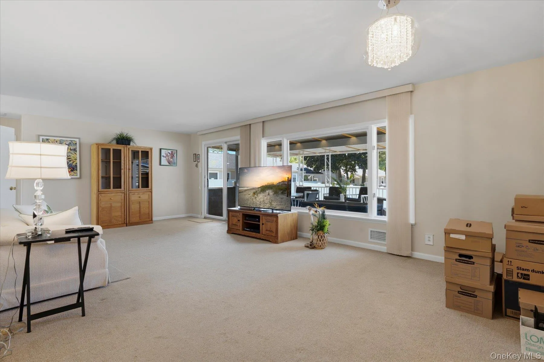 14x26 Living Room with lots of windows overlooking the beautiful cement covered porch. 14x26 Living Room with lots of windows overlooking the beautiful cement covered porch.