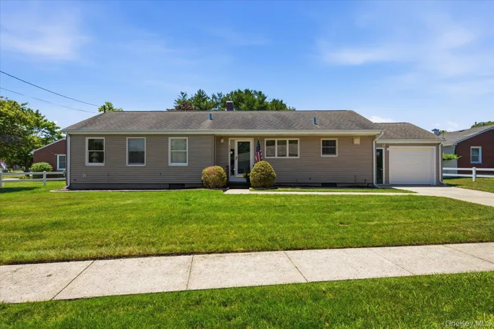Front of home with Cement Driveway and Sidewalk lined street