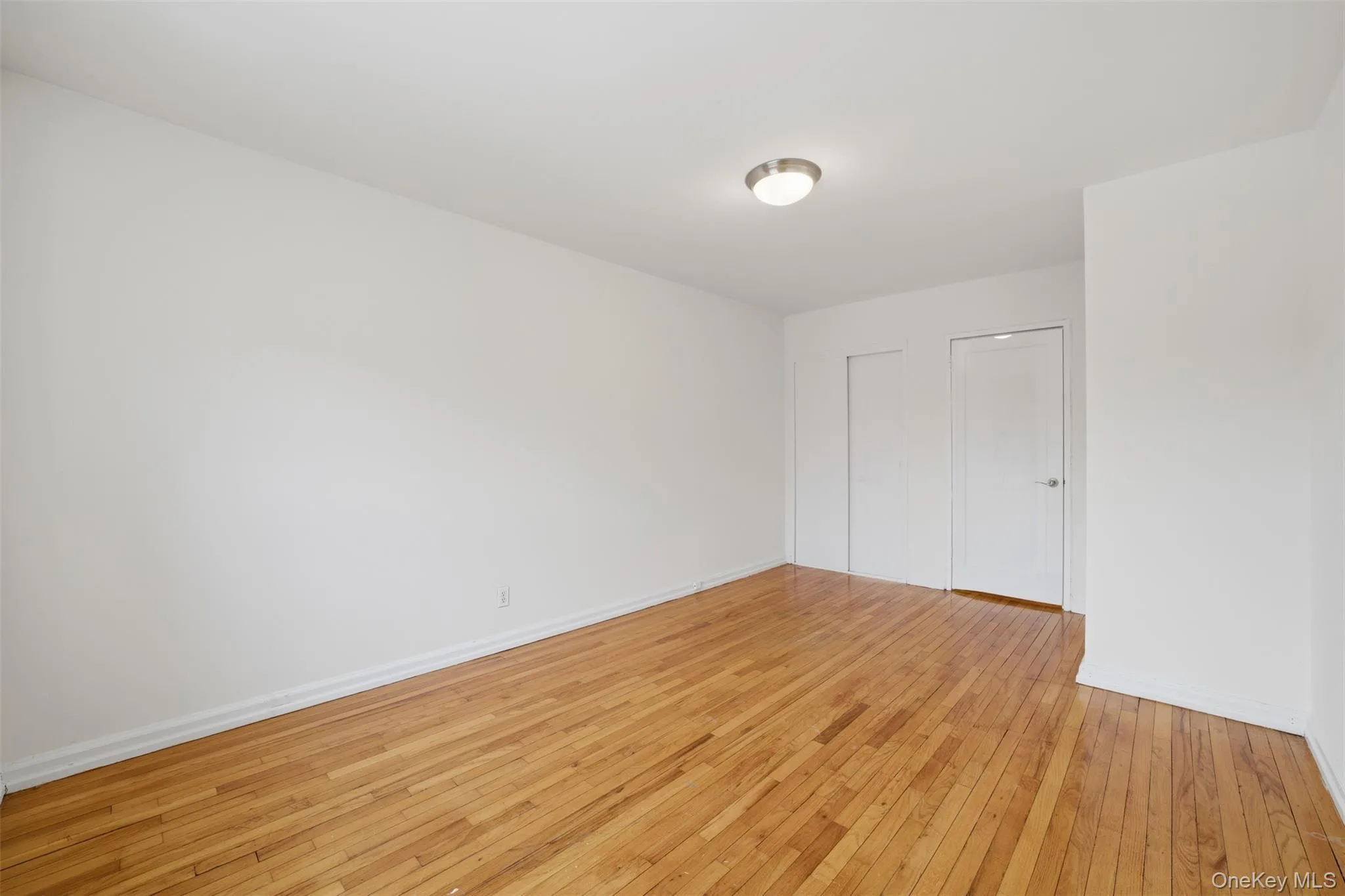 Bedroom featuring hardwood floors. Bedroom featuring hardwood floors.