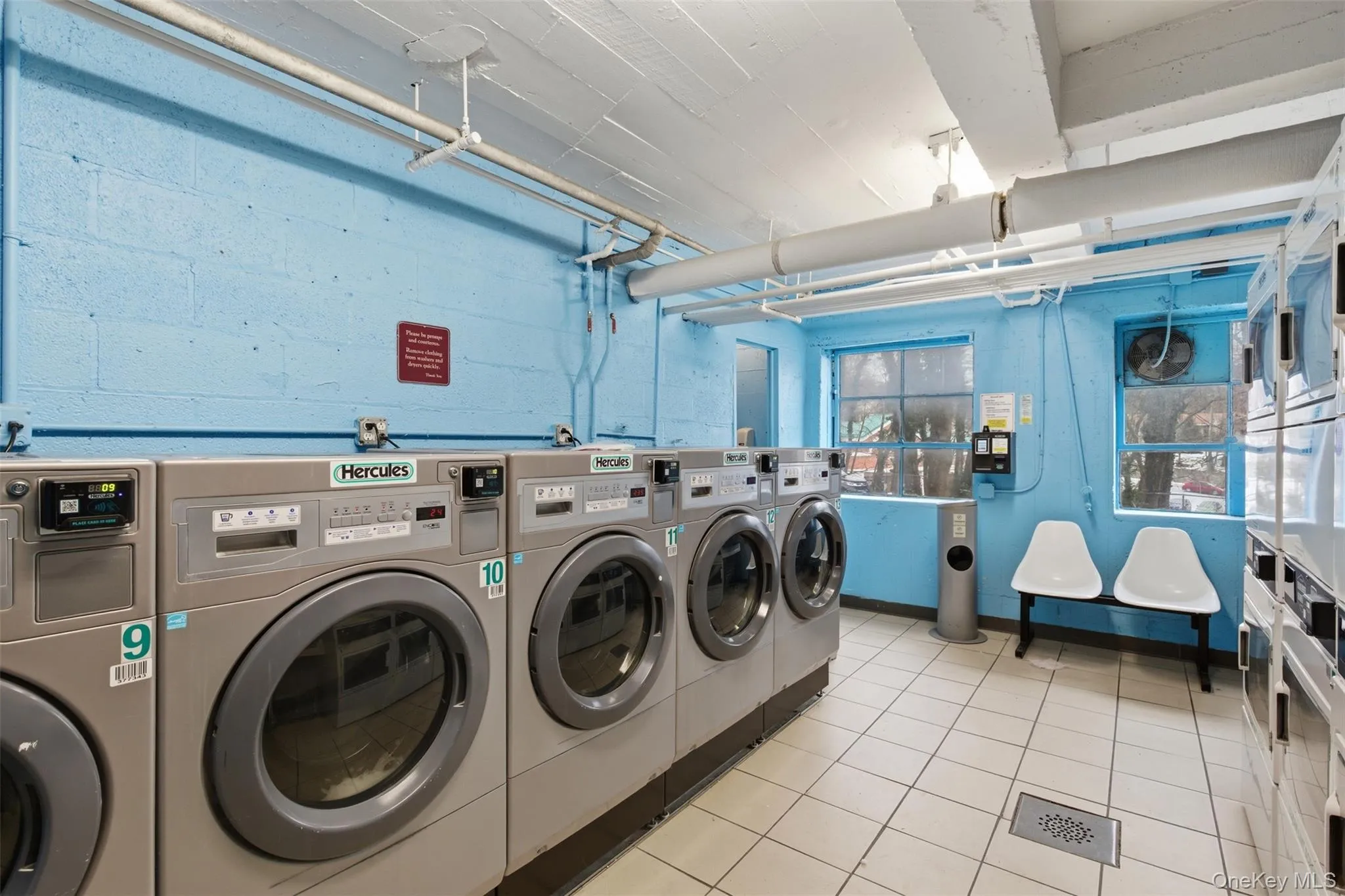 Community laundry featuring separate washer and dryer Community laundry featuring separate washer and dryer
