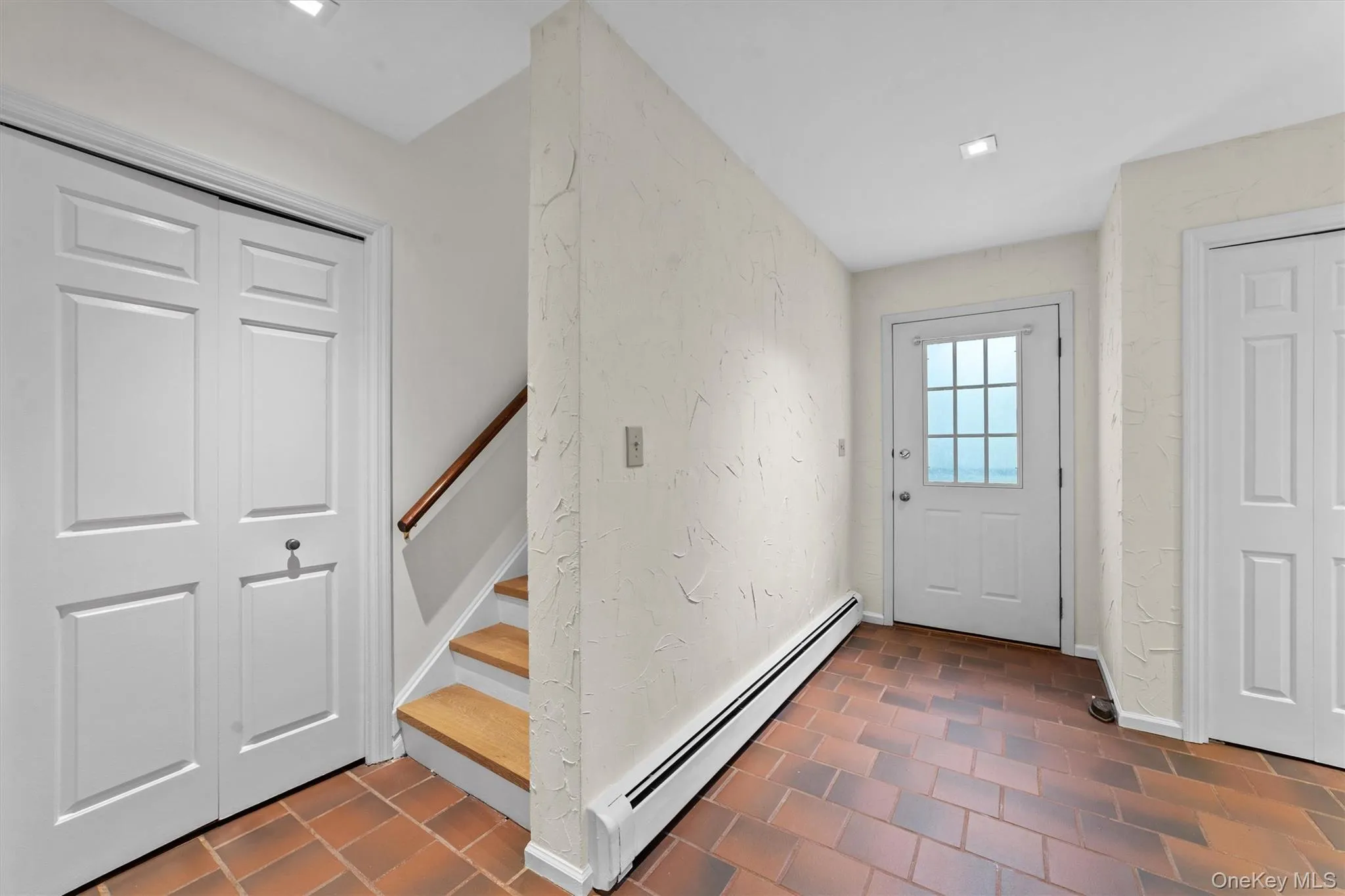Large storage closet that runs under stairs leading to the second floor primary bedroom Large storage closet that runs under stairs leading to the second floor primary bedroom