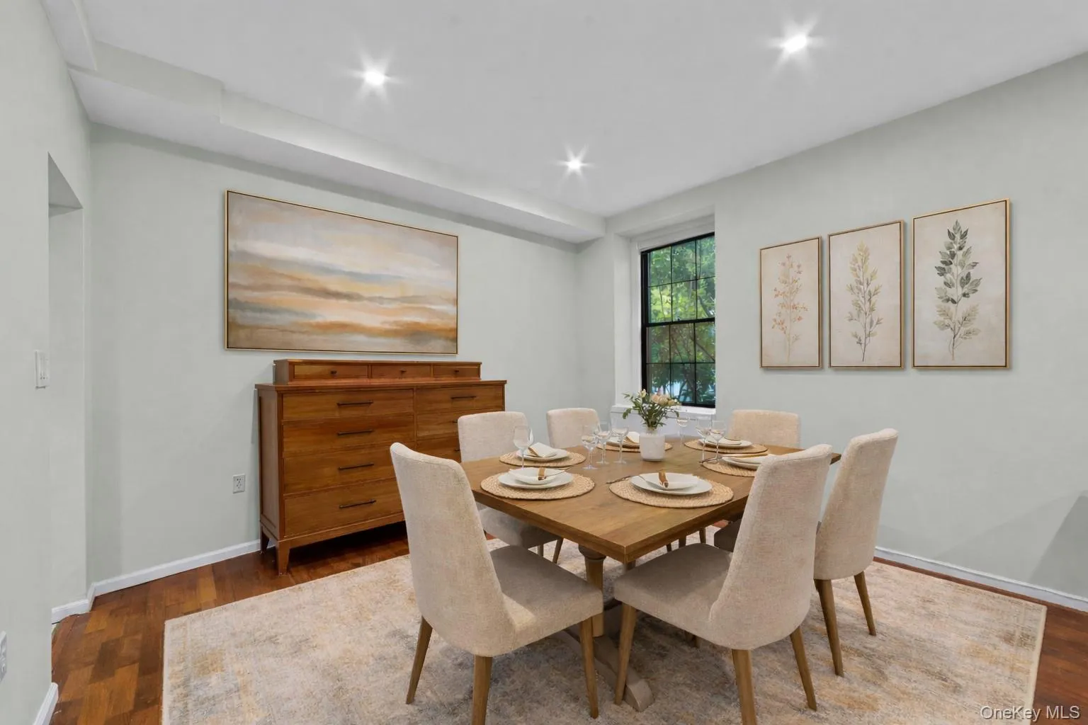 Open concept dining area with rich wood floors, recessed lighting - virtually staged Open concept dining area with rich wood floors, recessed lighting - virtually staged