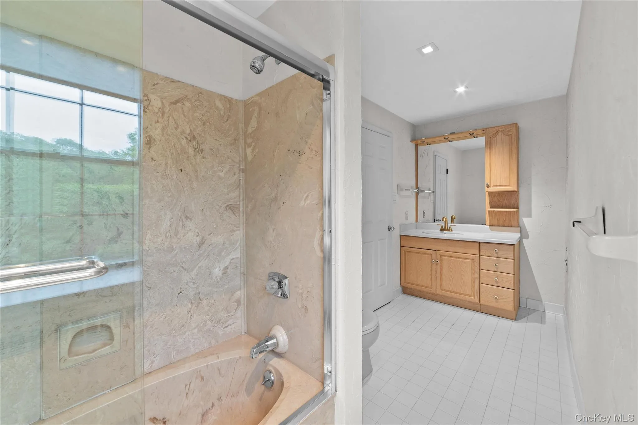 Another angle of the three piece primary full bathroom Another angle of the three piece primary full bathroom