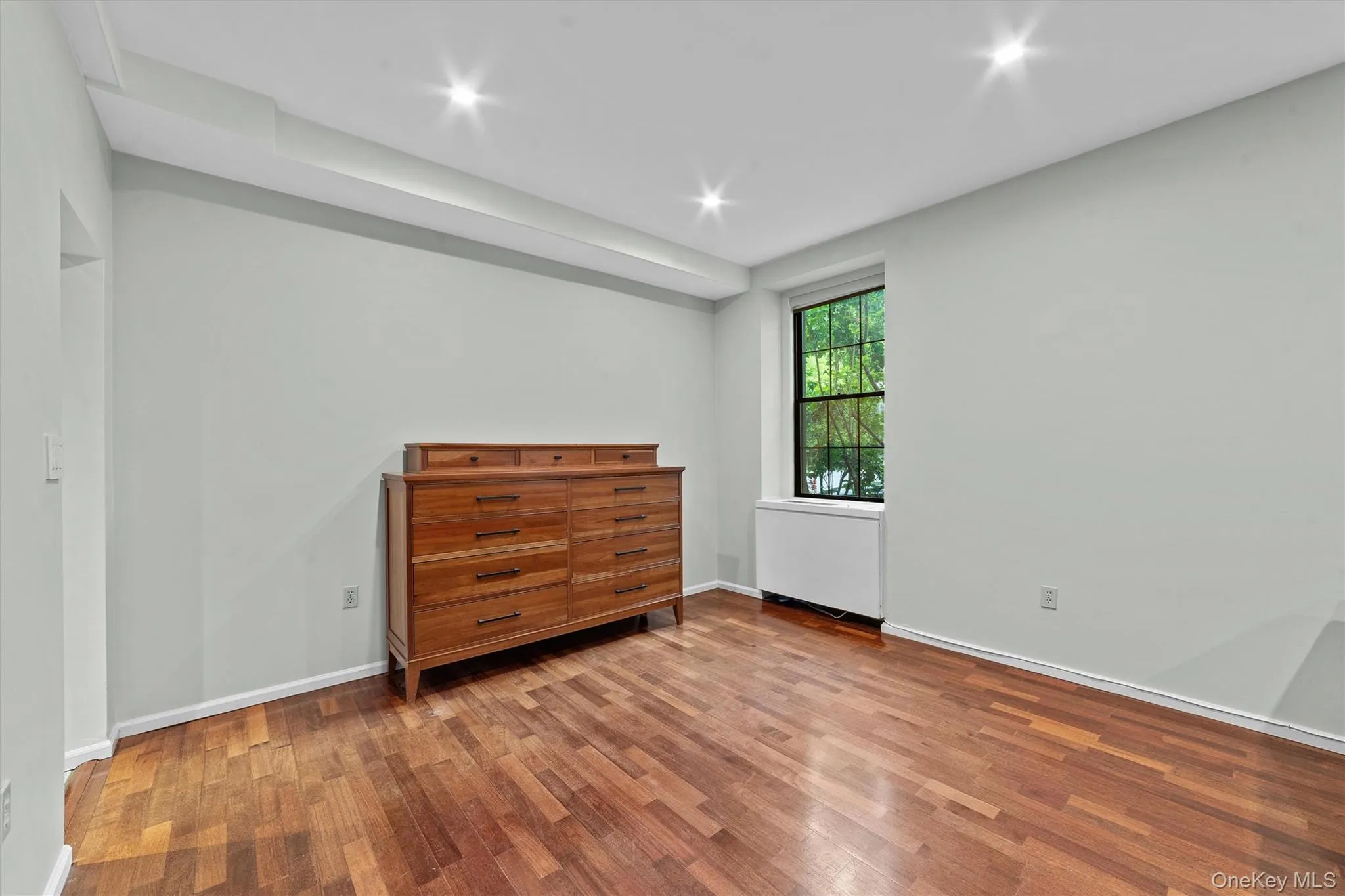 Open concept dining area with rich wood floors, recessed lighting Open concept dining area with rich wood floors, recessed lighting