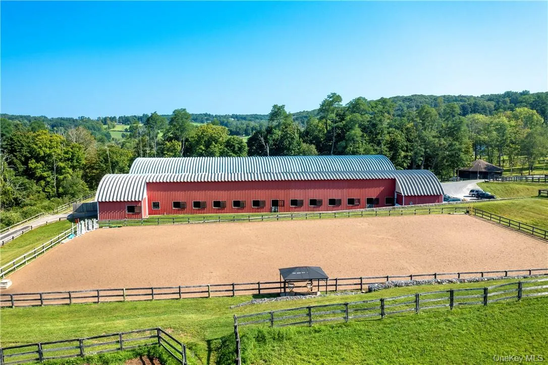 27 12' x 12'stalls, with a 200' x 90' indoor riding ring, and a 220' x 100' outdoor jumping ring with TraveLite dust free footings. 27 12' x 12'stalls, with a 200' x 90' indoor riding ring, and a 220' x 100' outdoor jumping ring with TraveLite dust free footings.