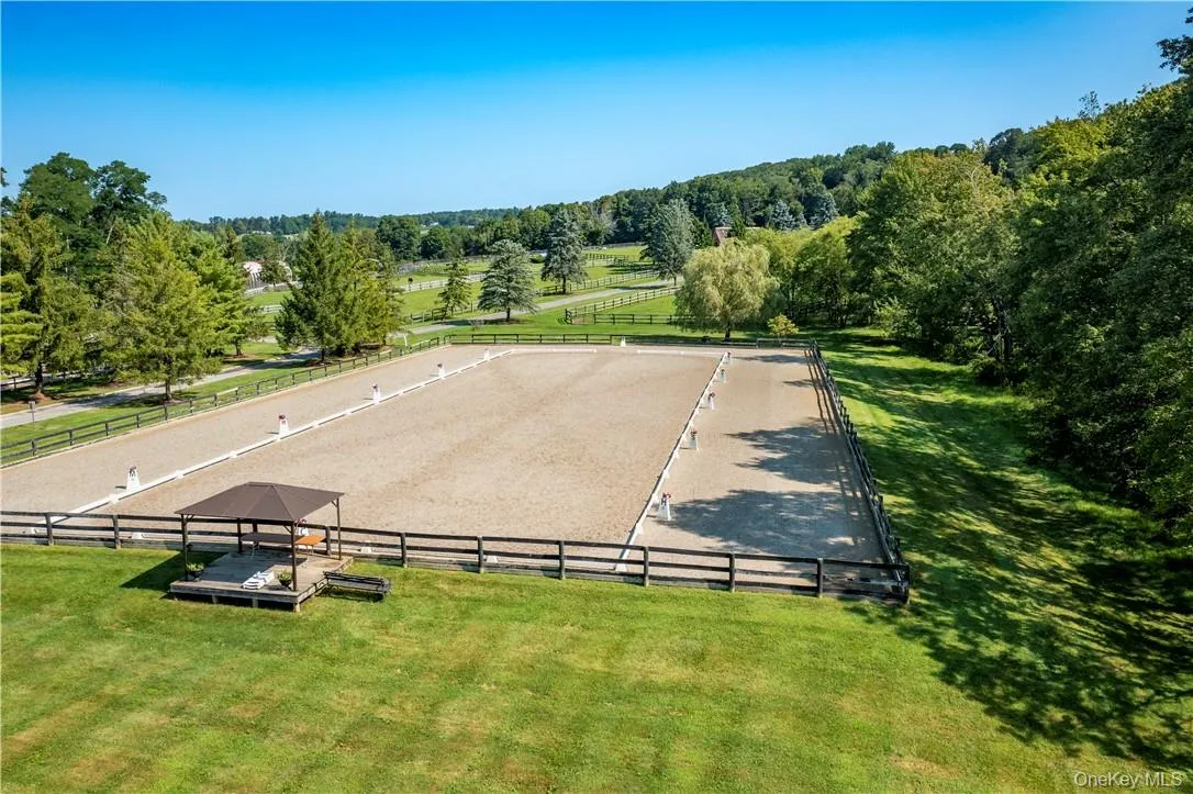 Adjacent to the indoor, a 220' x 100' outdoor jumping ring and a 200' x 80' outdoor dressage ring. View of the dressage ring. Adjacent to the indoor, a 220' x 100' outdoor jumping ring and a 200' x 80' outdoor dressage ring. View of the dressage ring.