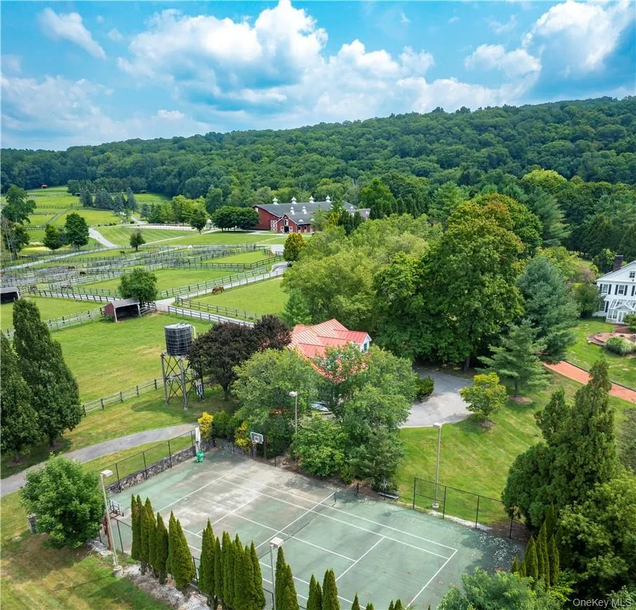 Tennis/basketball court next to guest house. Tennis/basketball court next to guest house.